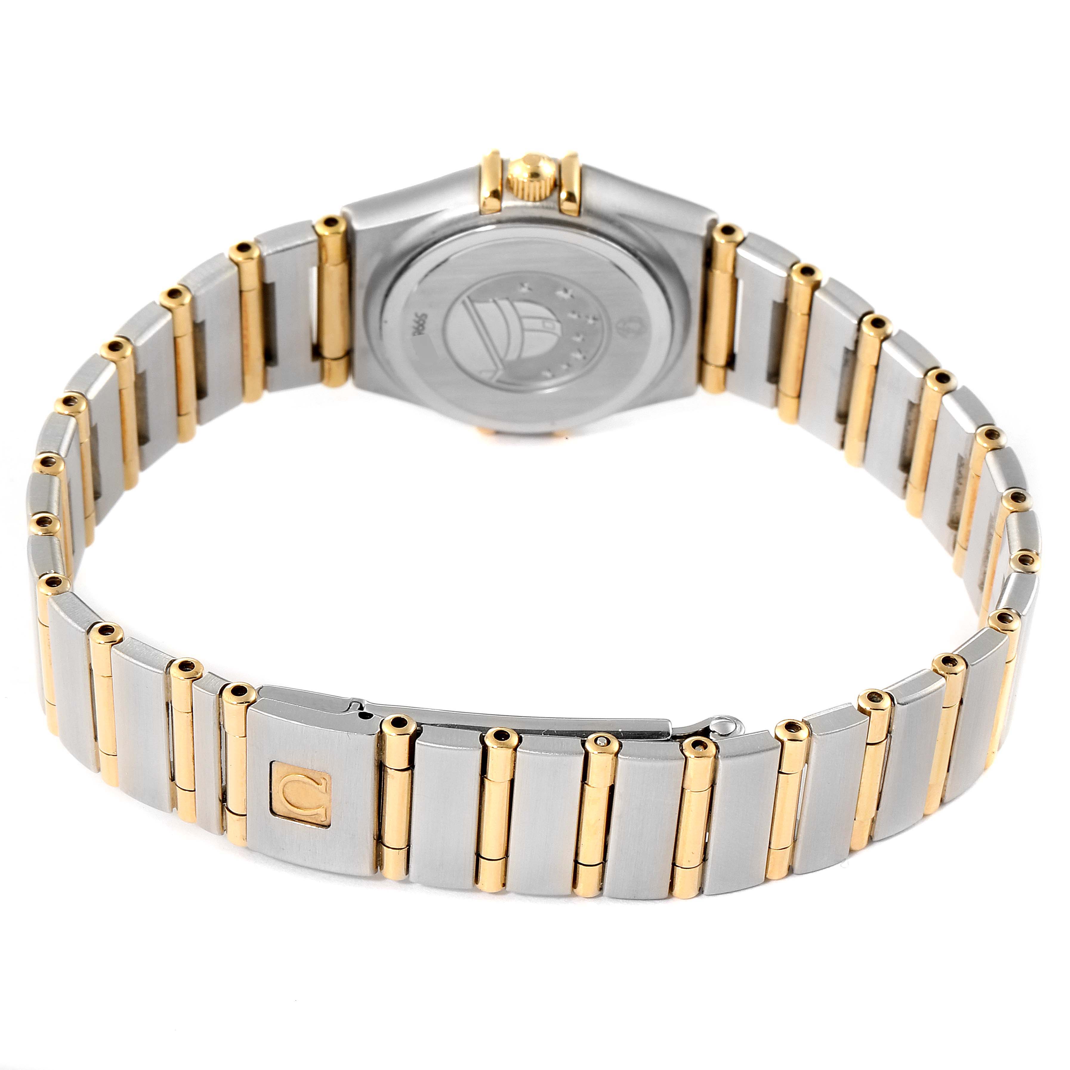 The image shows the back view of the Omega 1267.75.00 Women
s Steel and Gold (two tone) Mother of Pearl Dial 1267.75.00 Women
s Steel and Gold (two tone) Mother of Pearl Dial Constellation 95 model 1267.75.00 watch, highlighting its two-tone bracelet and case back.