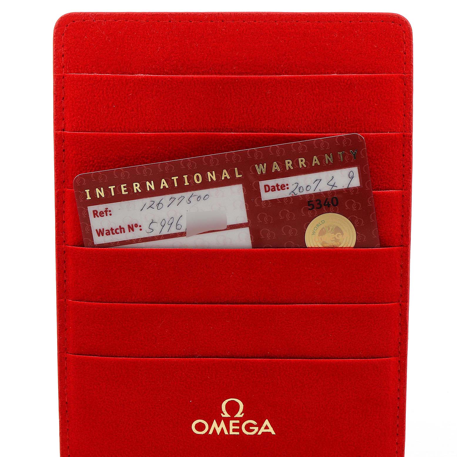 The image shows the international warranty card for the Omega 1267.75.00 Women
s Steel and Gold (two tone) Mother of Pearl Dial 1267.75.00 Women
s Steel and Gold (two tone) Mother of Pearl Dial Constellation 95 Mother of Pearl Diamond Watch 1267.75.00, inside a red Omega 1267.75.00 Women
s Steel and Gold (two tone) Mother of Pearl Dial 1267.75.00 Women
s Steel and Gold (two tone) Mother of Pearl Dial cardholder.