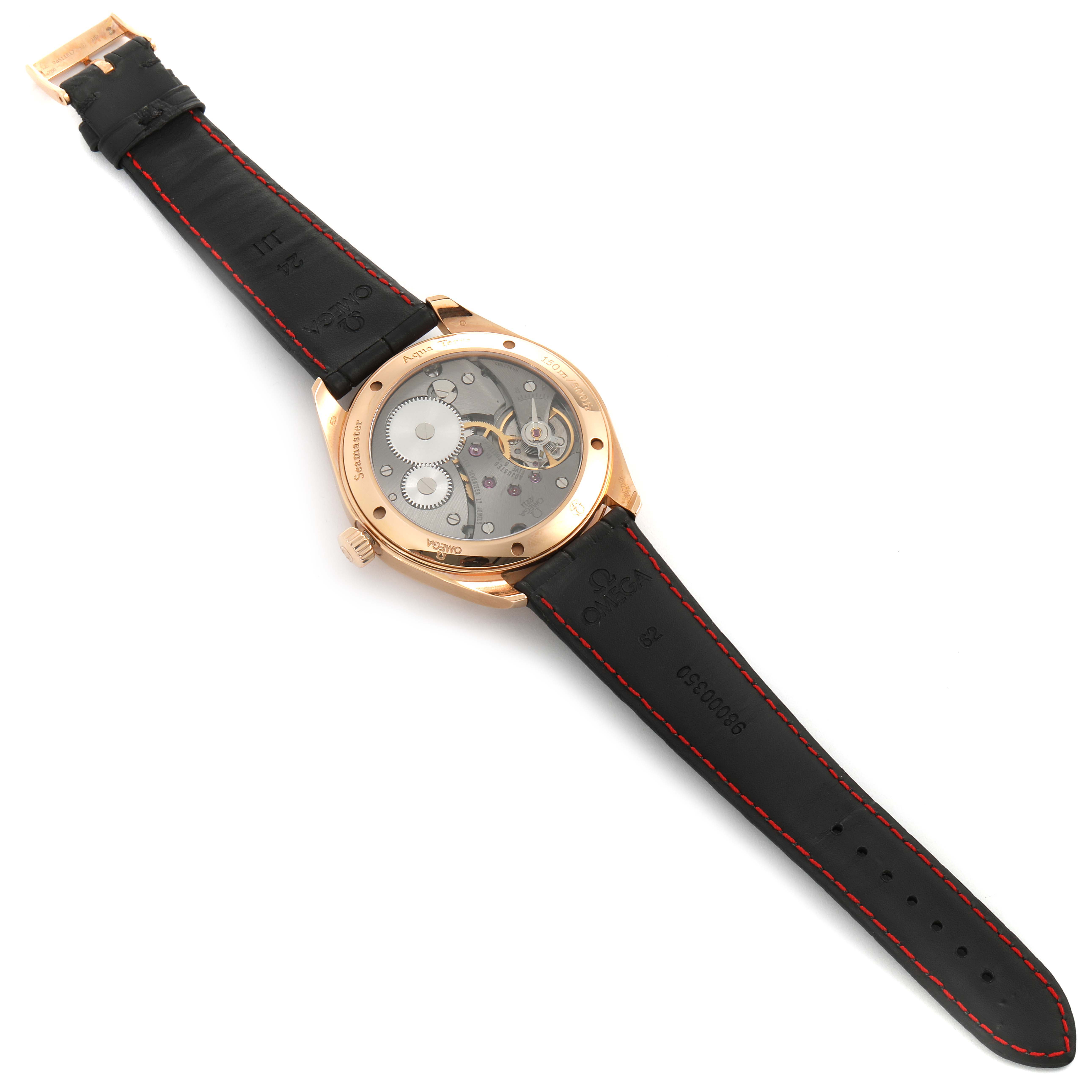 The image shows the back view of an Omega Aqua Terra 231.53.49.10.06.001 Men's Rose Gold Grey Dial 231.53.49.10.06.001 Men's Rose Gold Grey Dial watch, highlighting its movement and black strap with red stitching.