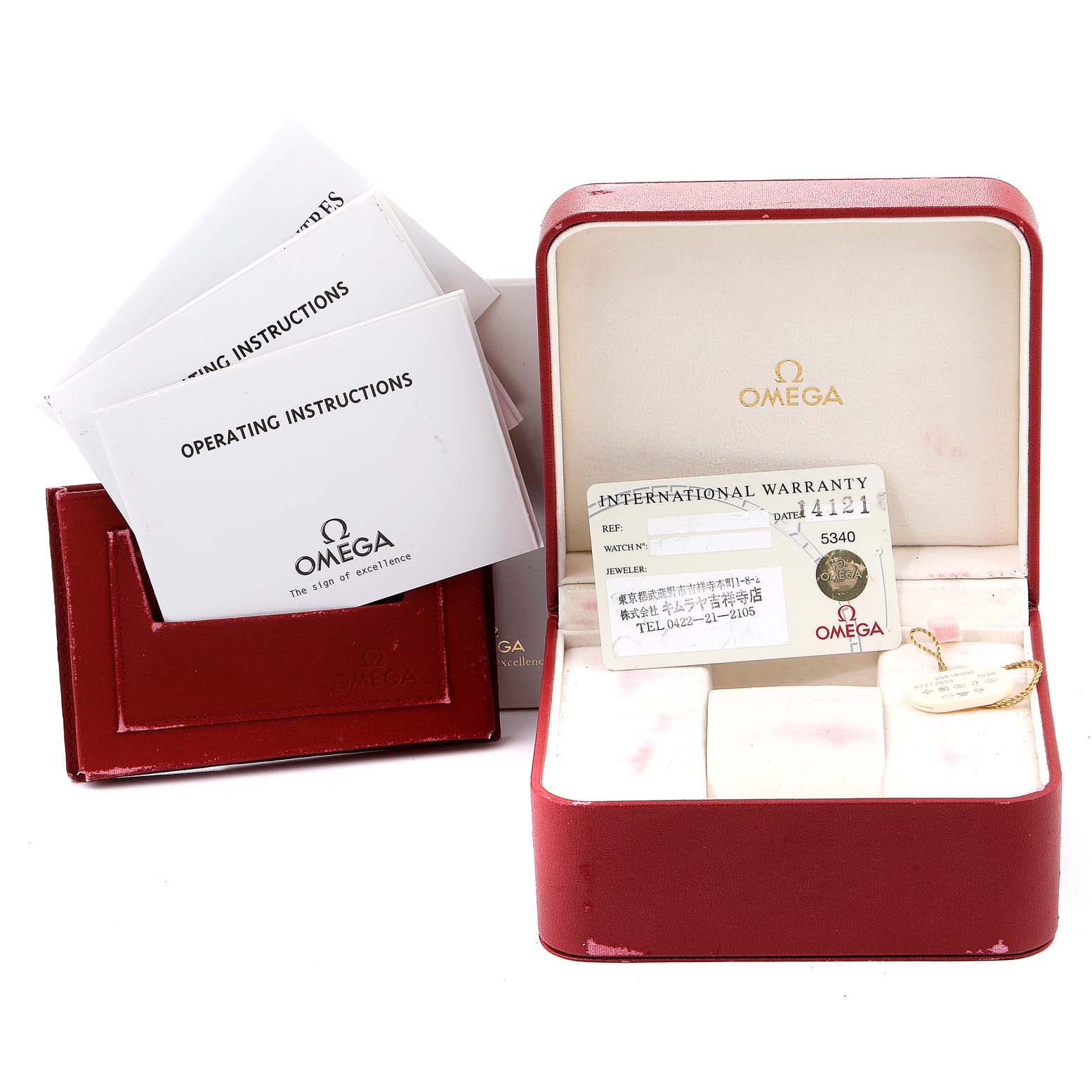 The image shows the accessories of an Omega Seamaster 2561.80.00 Men
s Stainless Steel Blue Dial 2561.80.00 Men
s Stainless Steel Blue Dial watch, including warranty cards, instruction booklets, and a red watch box.