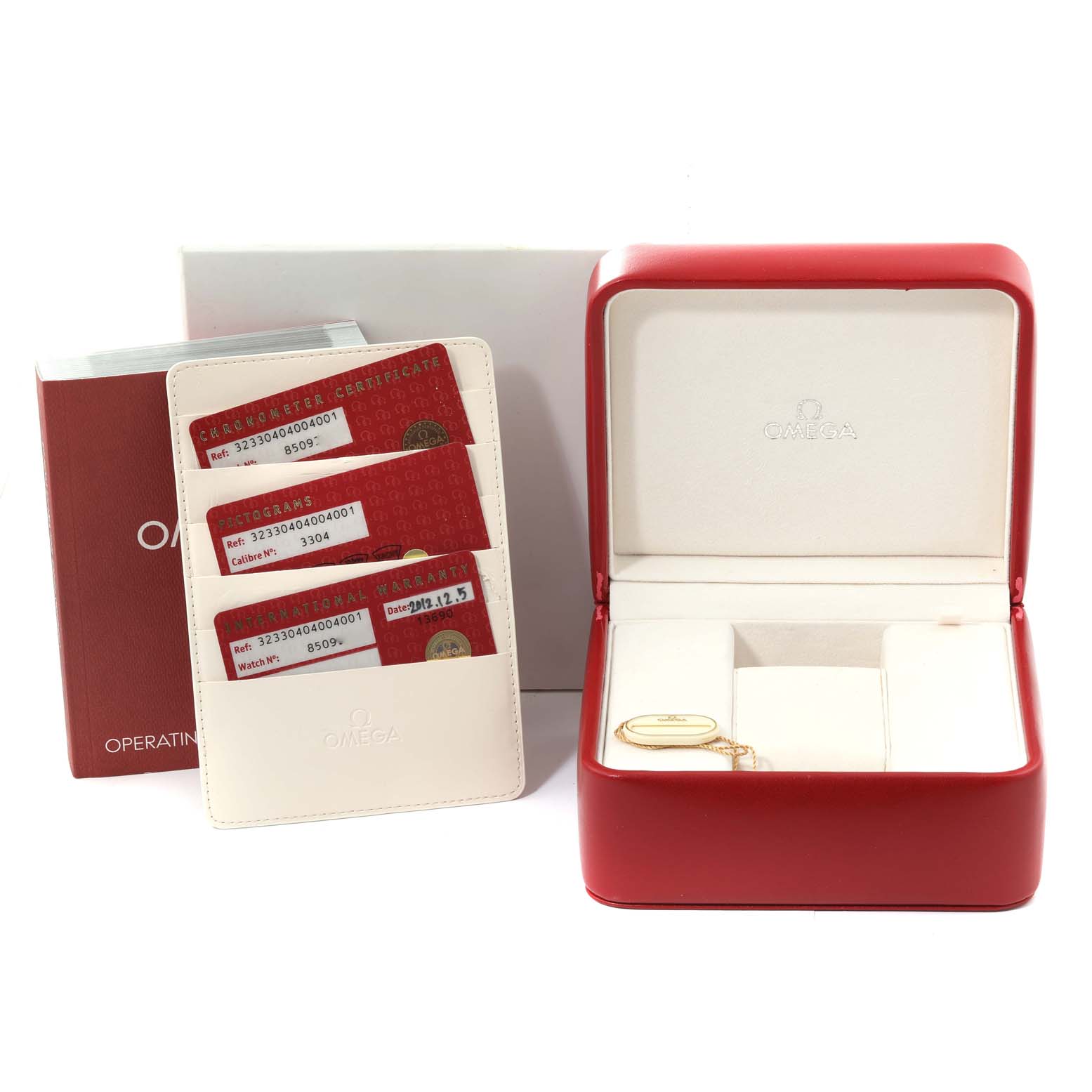 This image shows the Omega Speedmaster 323.30.40.40.04.001 Men
s Stainless Steel White Dial 323.30.40.40.04.001 Men
s Stainless Steel White Dial accessories including a red watch box, user manuals, warranty cards, and a leather cardholder.