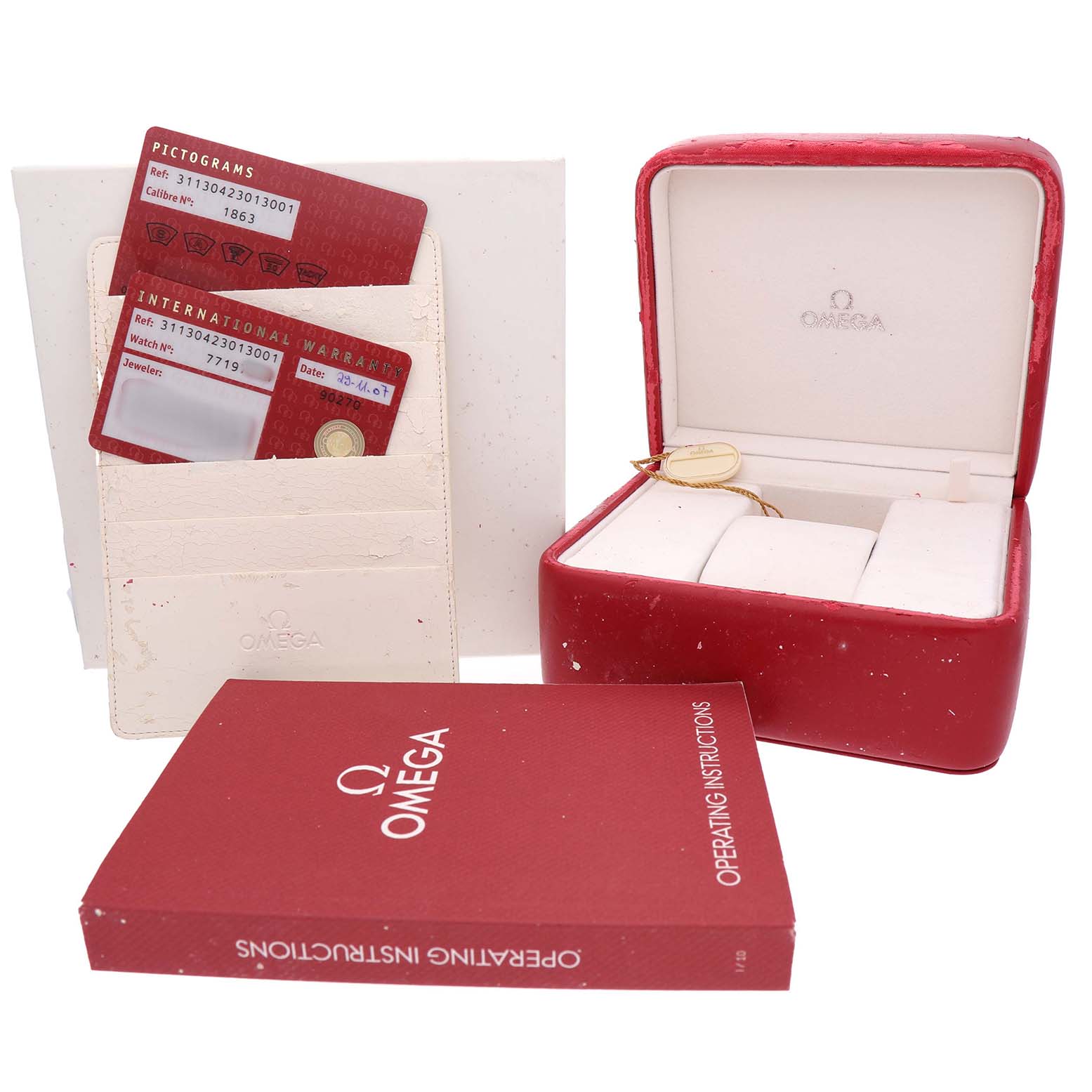 The image shows an Omega Speedmaster 311.30.42.30.13.001 Men's Stainless Steel Brown Dial watch box, warranty cards, and an operating manual.