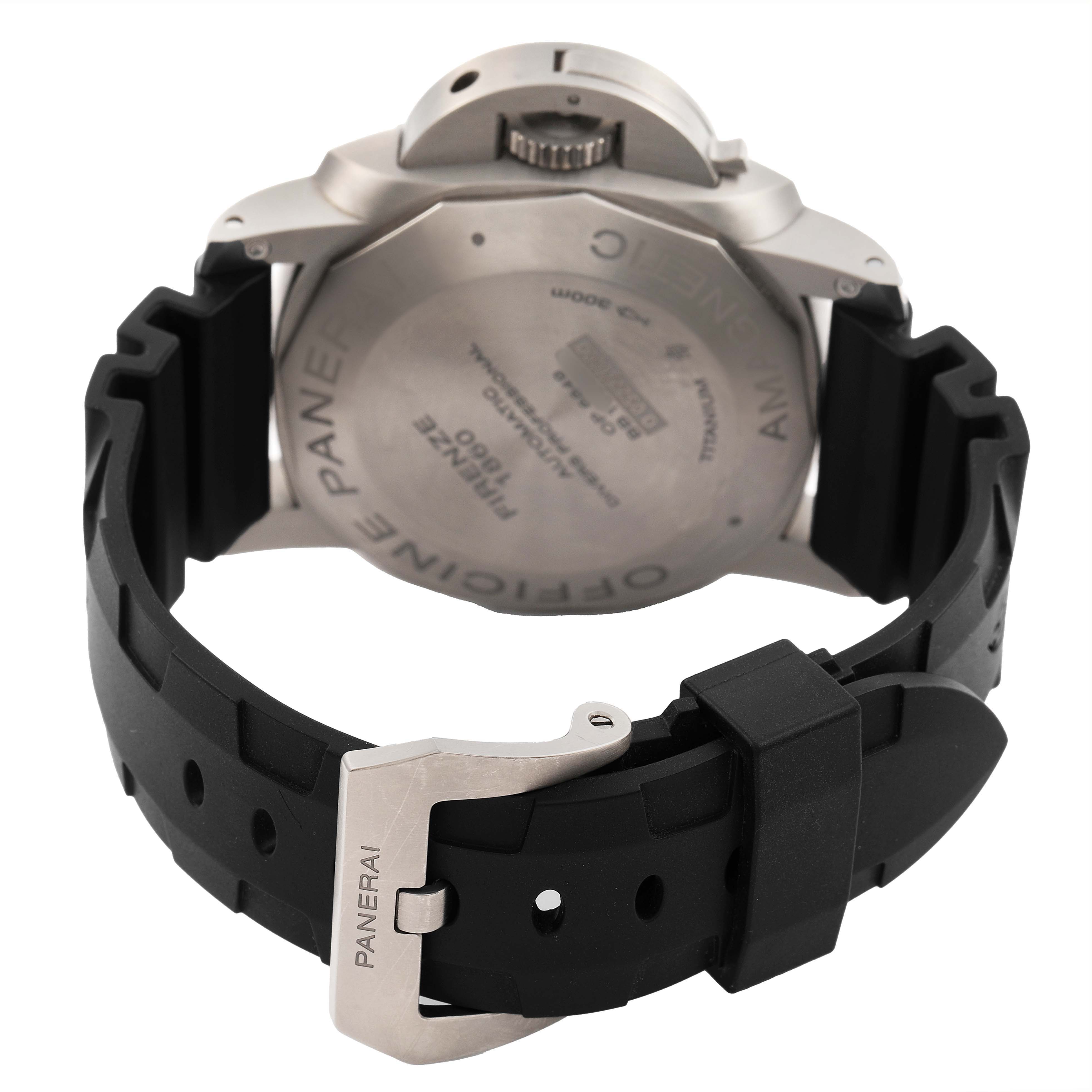 The image shows the back of a Panerai Luminor PAM00389 Men's Titanium Black Dial watch, highlighting the case back, crown guard, and black rubber strap with buckle.