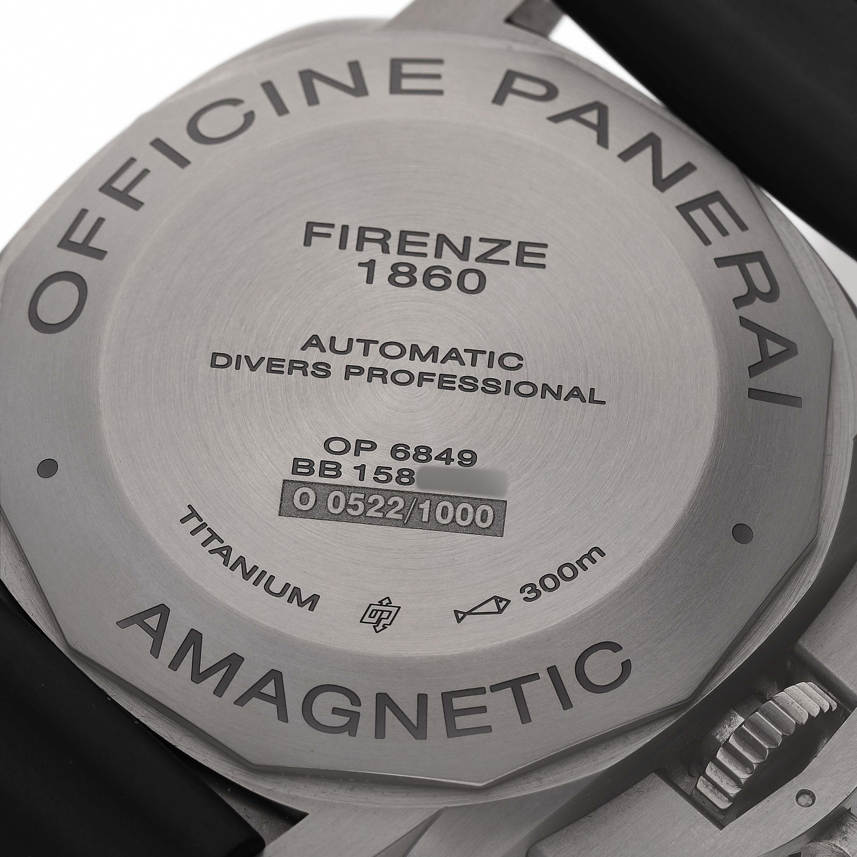 The image shows the back case of a Panerai Luminor PAM00389 Men's Titanium Black Dial watch, highlighting its engravings and construction materials.