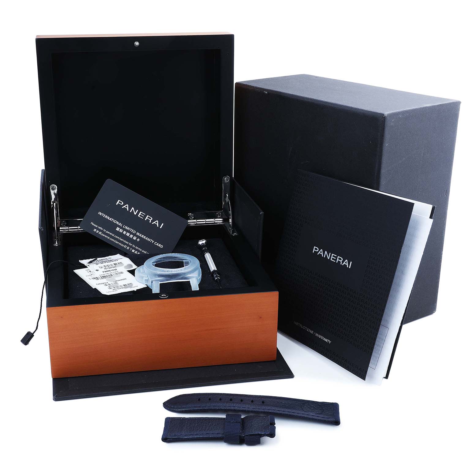 The image shows a Panerai Submersible PAM01232 Men's Ceramic Blue Dial watch box, warranty card, manual, additional strap, and tool from a top angle.