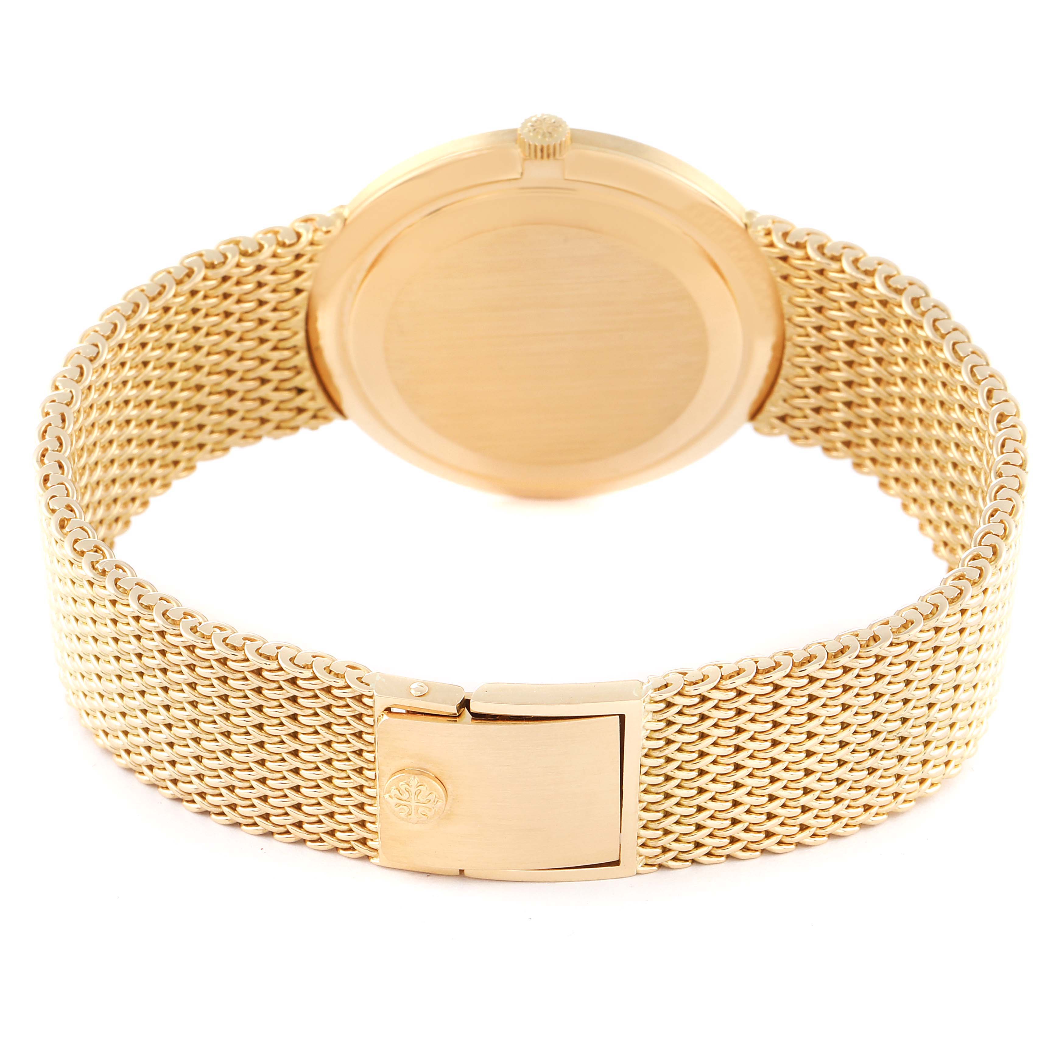 The image shows the back and clasp of a Patek Philippe Calatrava 3893/1 Men's Yellow Gold Beige Dial 3893/1 Men's Yellow Gold Beige Dial watch at an angle highlighting the bracelet and case back.