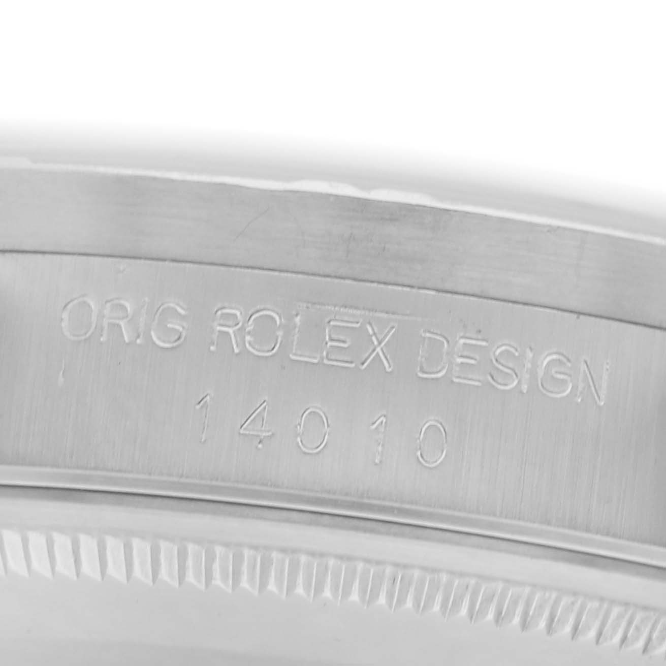 The image shows a close-up of the side of a Rolex Air-King 14010 Men's Stainless Steel Silver Dial 14010 Men's Stainless Steel Silver Dial watch, highlighting the model number and "ORIG ROLEX DESIGN" engraving.