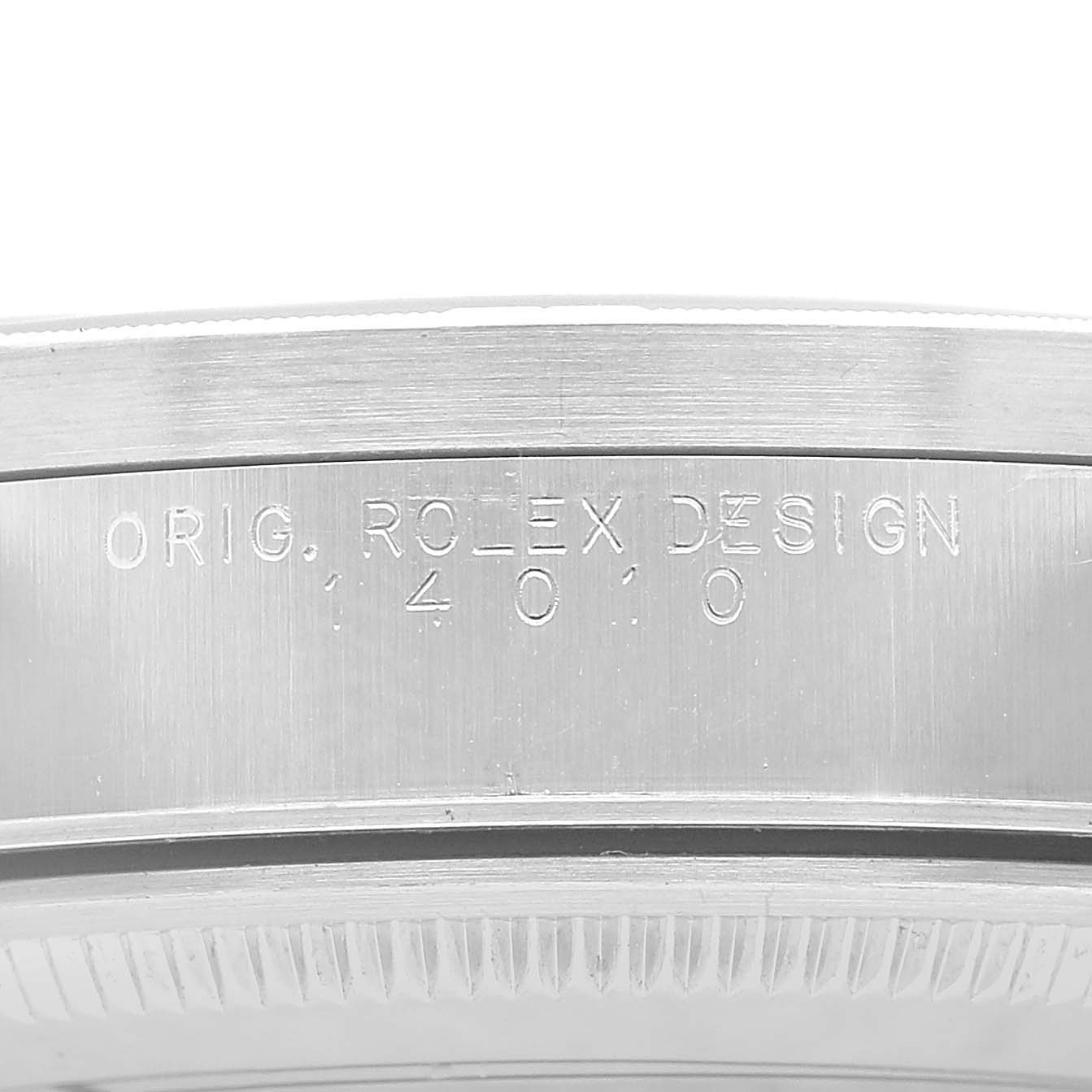 The image shows a close-up of the side of a Rolex Air-King 14010 Men's Stainless Steel Black Dial watch case with engraved text.