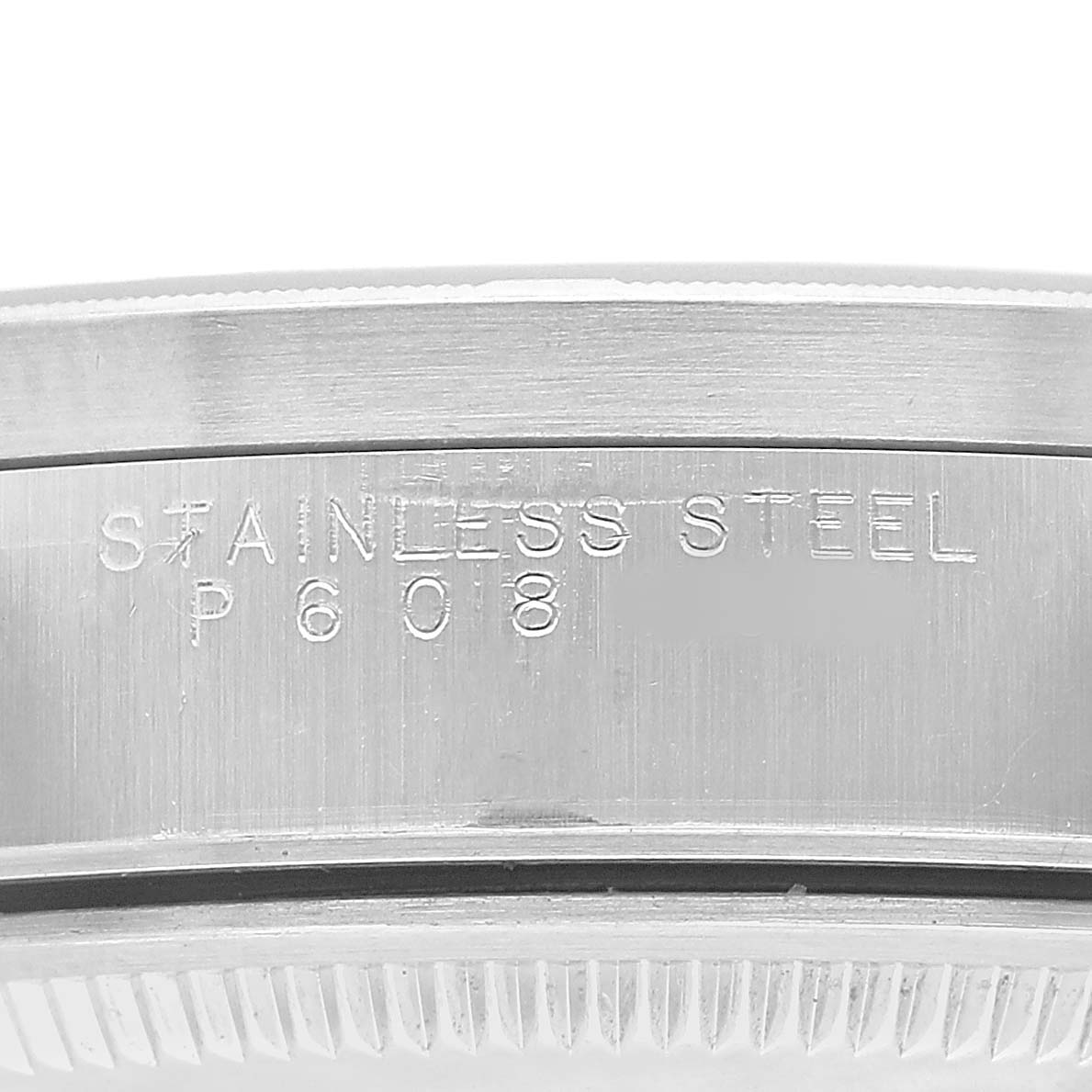 The image shows the engraved side detailing of the stainless steel bezel on a Rolex Air-King 14010 Men's Stainless Steel Black Dial watch.
