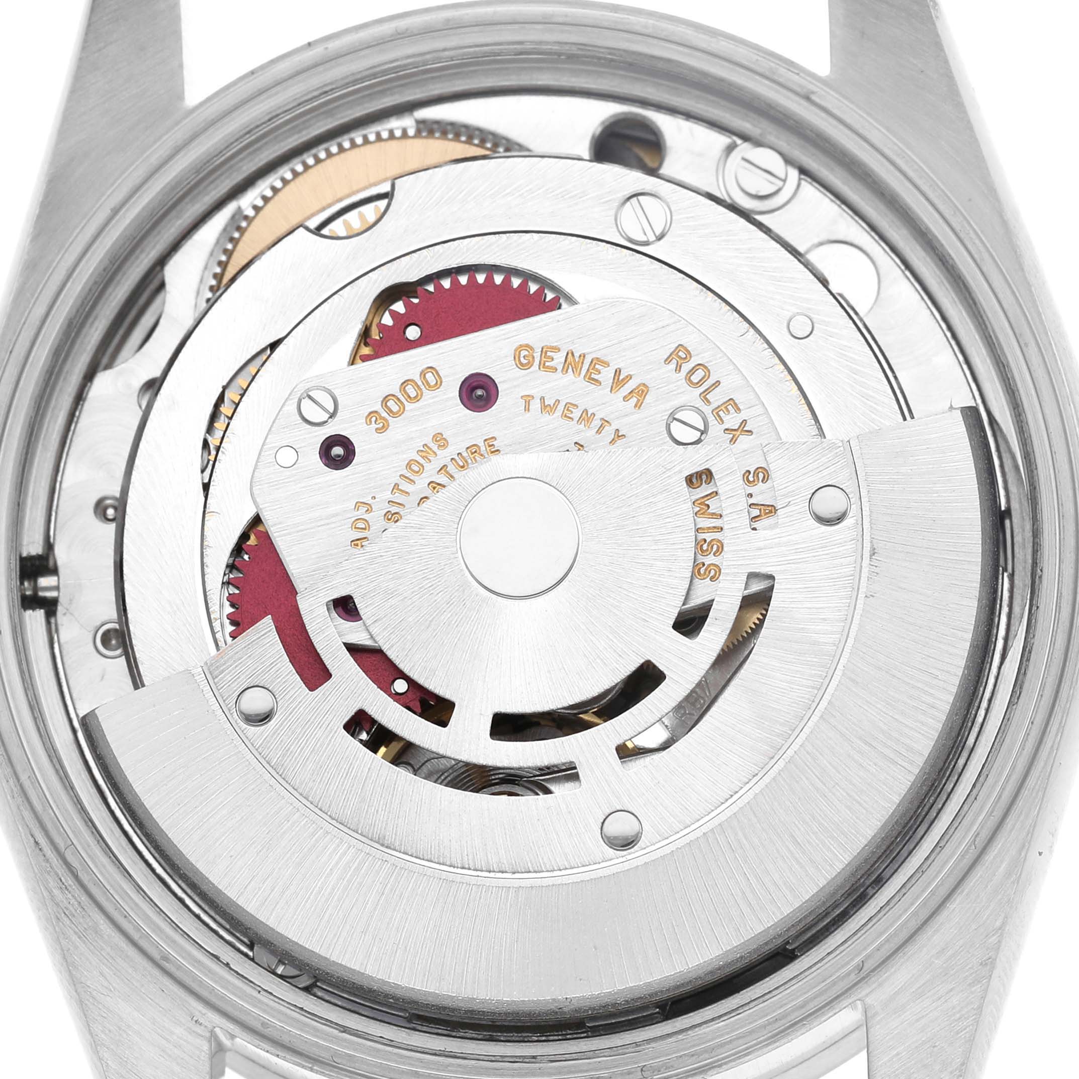 The image shows a close-up view of the movement mechanism of a Rolex Air-King 14010 Men's Stainless Steel Black Dial watch, highlighting the rotor and gears.