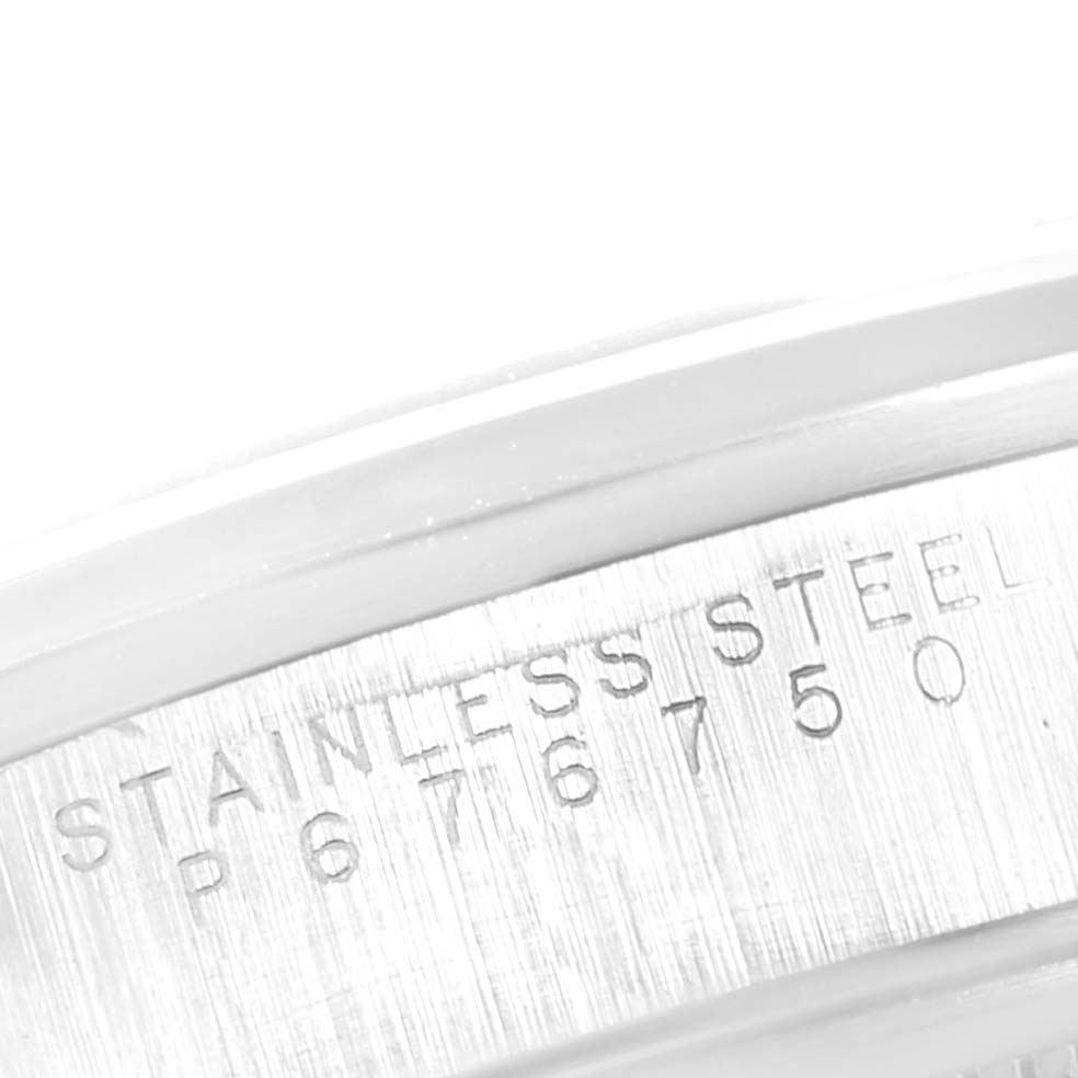 This image shows a close-up of the side engraving on a Rolex Date 15200 Men's Stainless Steel Silver Dial 15200 Men's Stainless Steel Silver Dial model, indicating the stainless steel material and serial number.