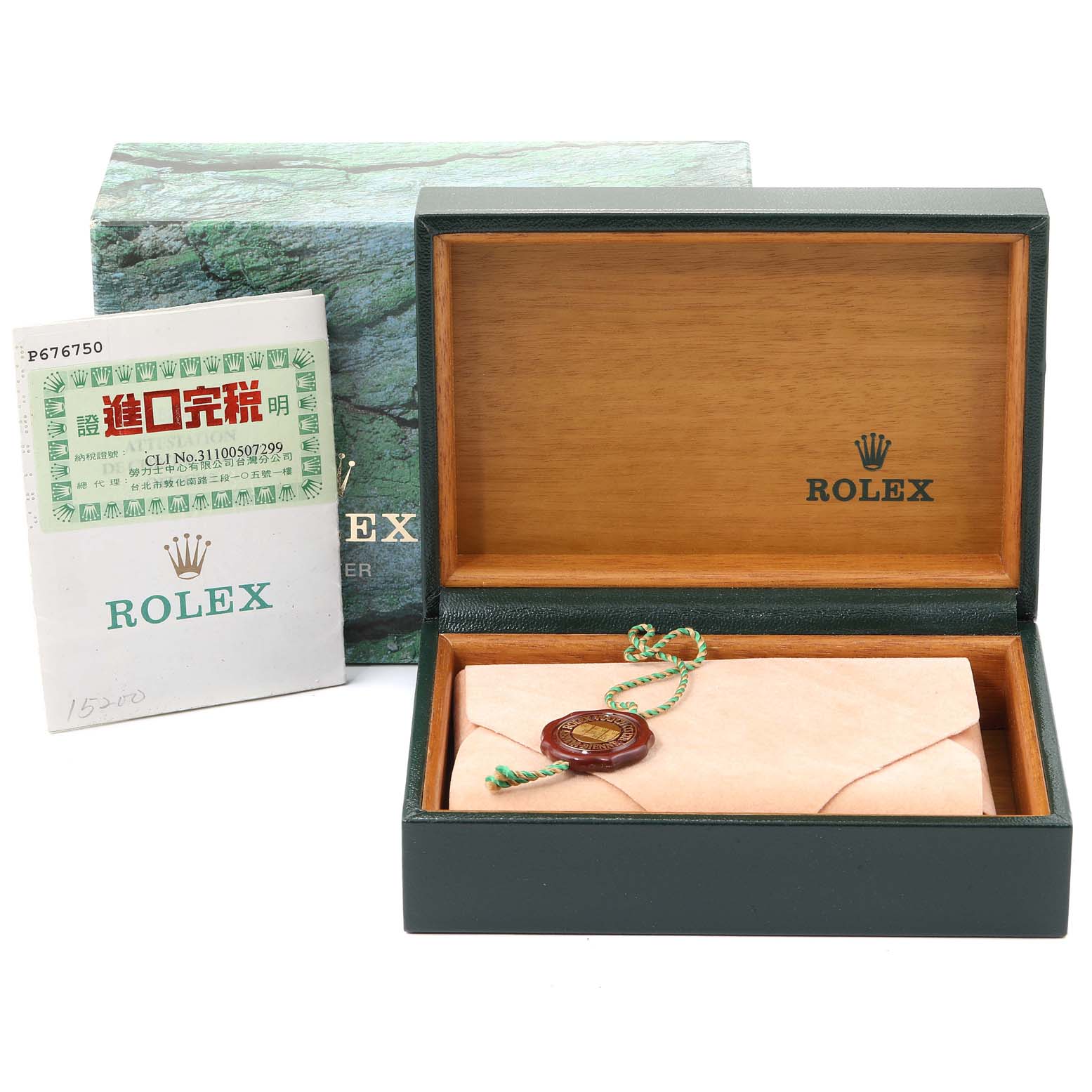 The image shows a Rolex box for the Date model, an authenticity card, and a tag, viewed from a front angle.