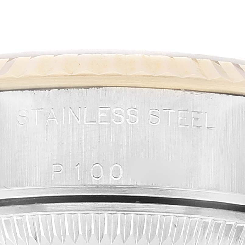 The image shows a close-up of the bezel and part of the casing with "Stainless Steel" engraving on a Rolex Datejust 79173 Women's Steel and Gold (two tone) Grey Dial 79173 Women's Steel and Gold (two tone) Grey Dial watch.