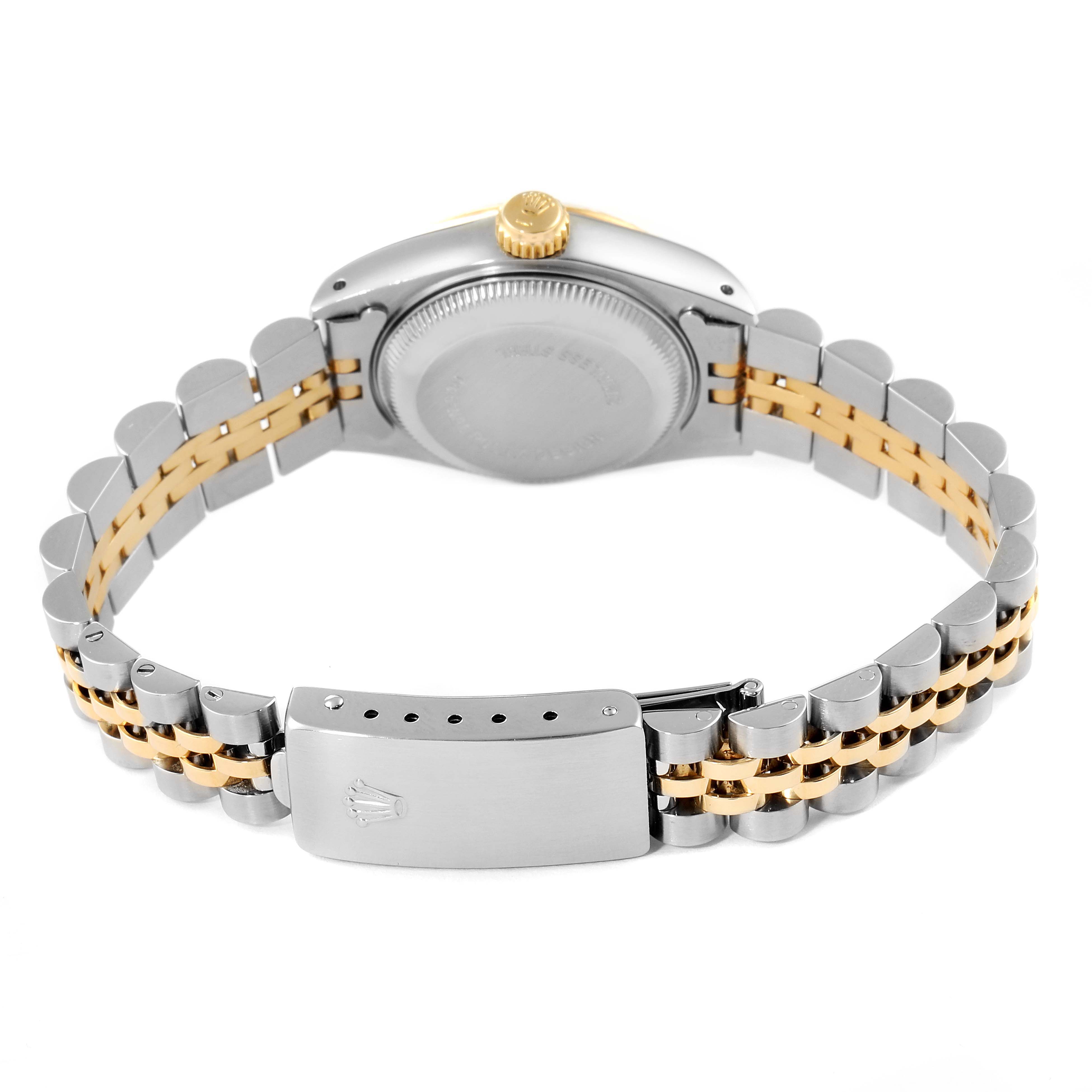 The image shows the back view of a Rolex Datejust 69173 Women
s Steel and Gold (two tone) Champagne Dial 69173 Women
s Steel and Gold (two tone) Champagne Dial watch, highlighting its two-tone bracelet and clasp.