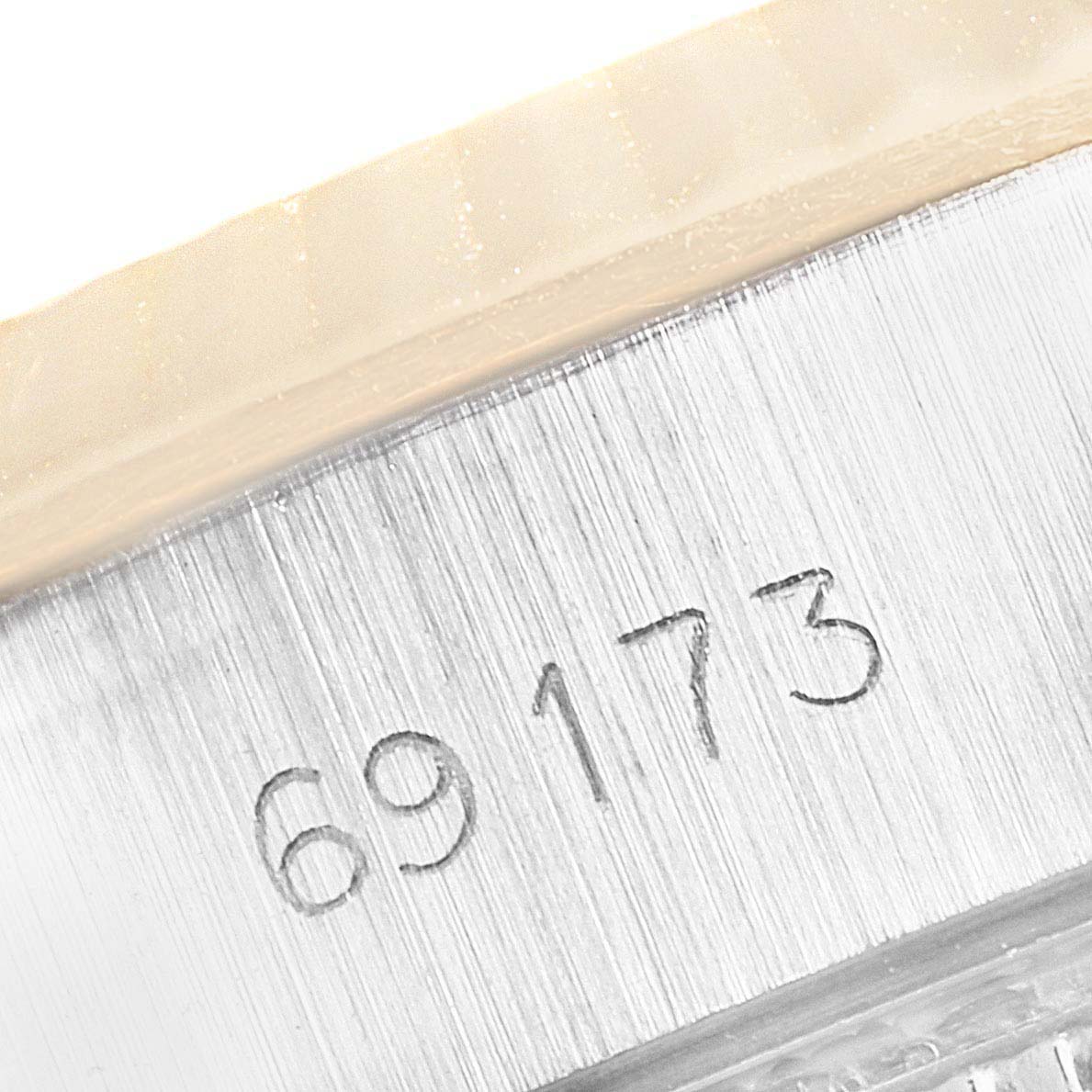 This image shows a close-up view of the model number engraving on the Rolex Datejust 69173 Women
s Steel and Gold (two tone) Champagne Dial 69173 Women
s Steel and Gold (two tone) Champagne Dial watch case.