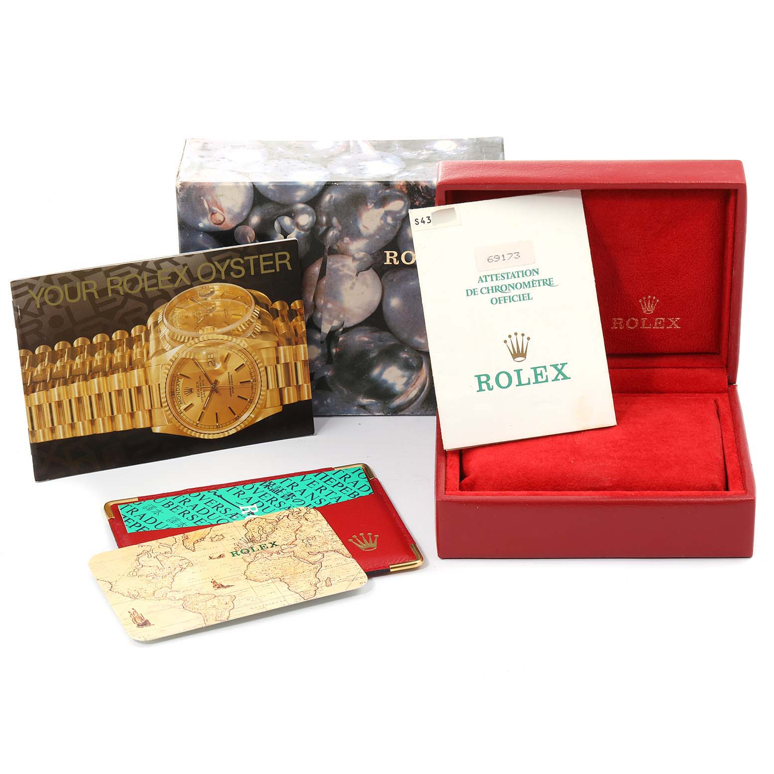 The image shows accessories for the Rolex Datejust 69173 Women's Steel and Gold (two tone) Black Dial 69173 Women's Steel and Gold (two tone) Black Dial model, including a box, manuals, certifications, and cards.