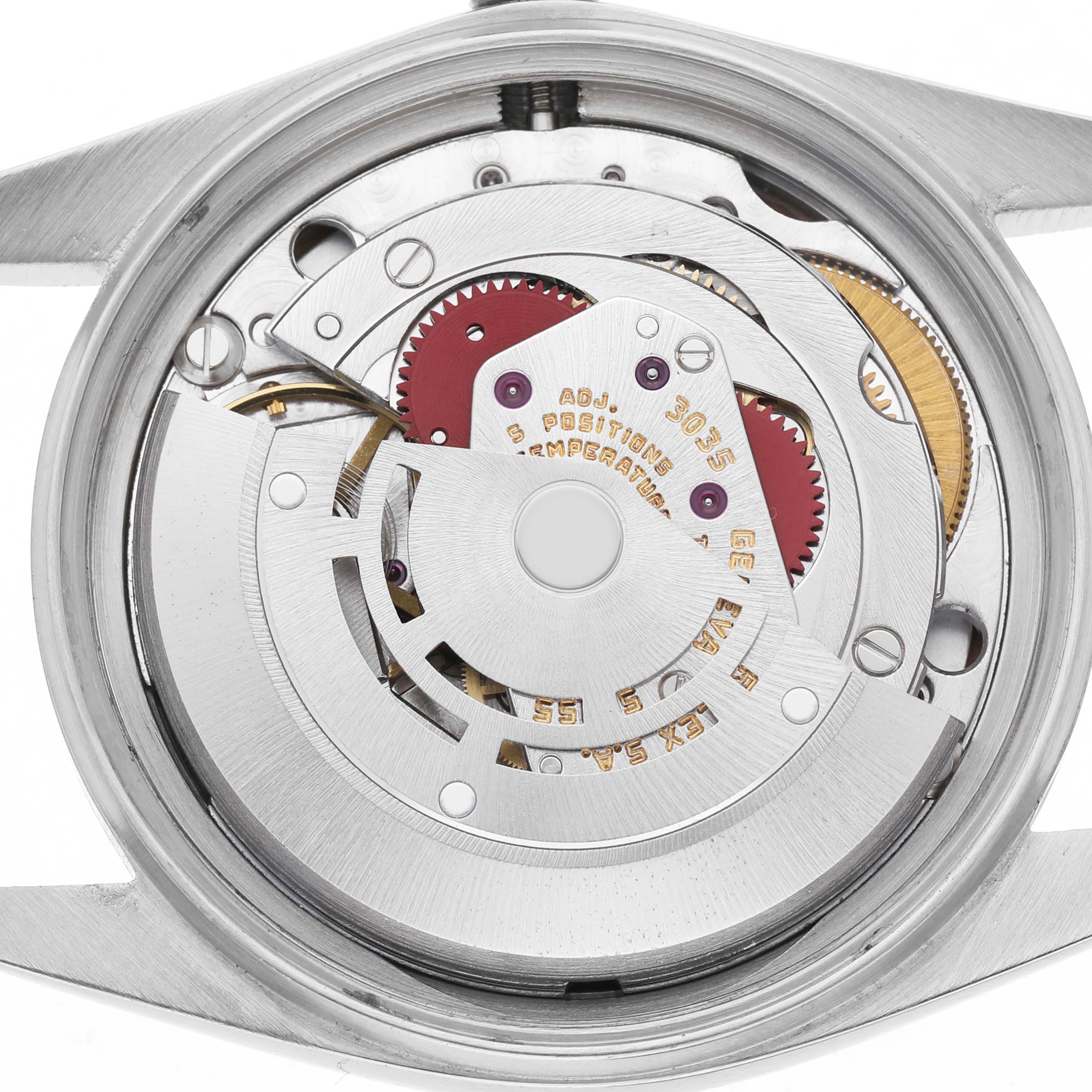 The image shows the movement of a Rolex Datejust 16014 Men's Stainless Steel Silver Dial, viewed from the back without the case back, highlighting gears and mechanisms.