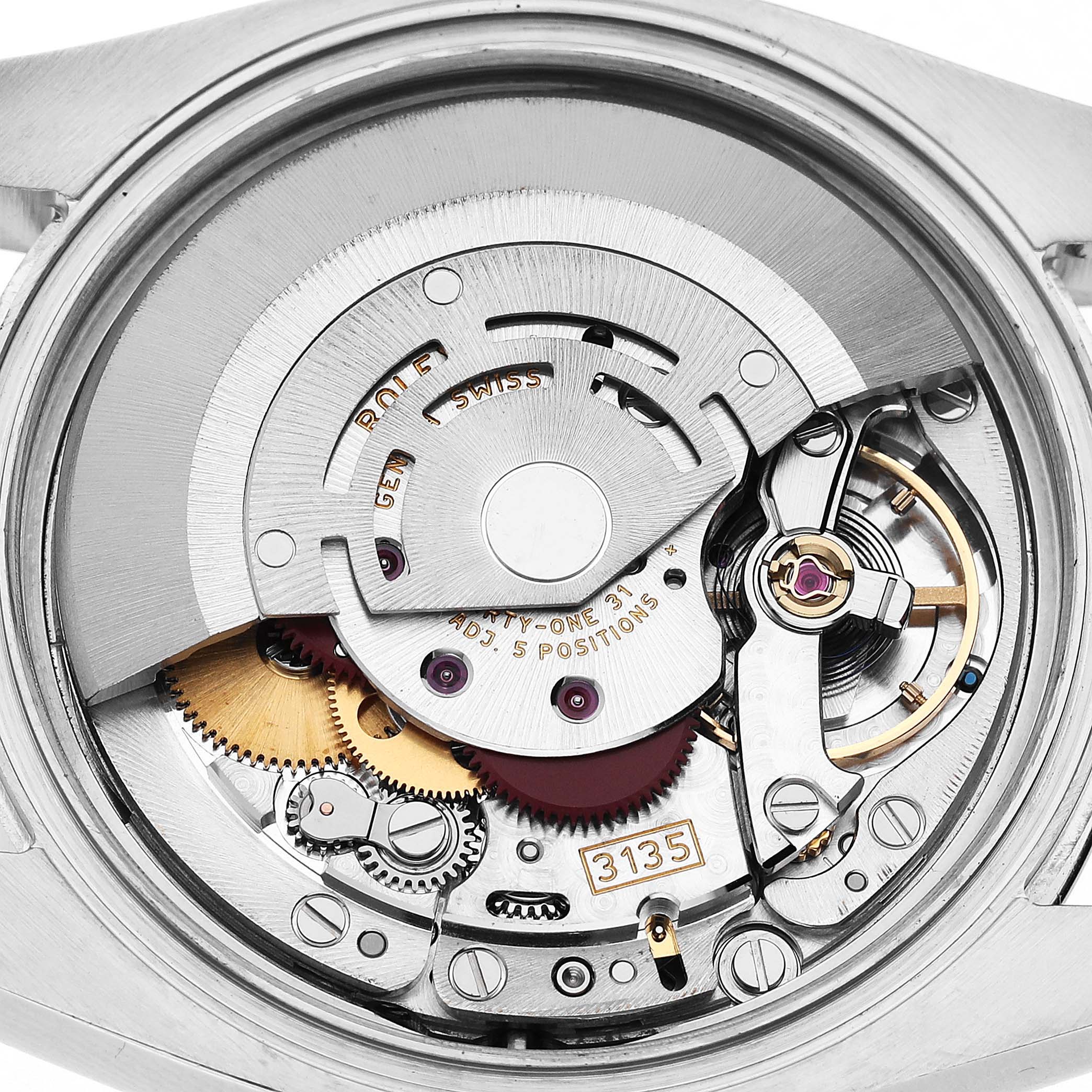 The image shows the movement of a Rolex Datejust 116234 Men's Stainless Steel Silver Dial watch, highlighting the rotor, gears, and mechanical components.