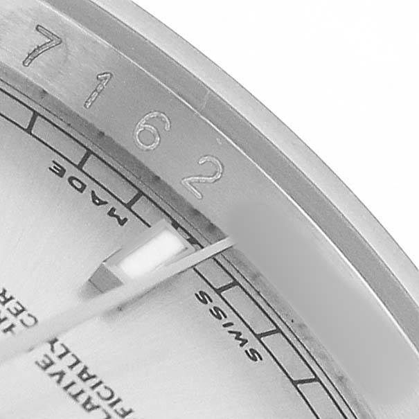 The image shows a close-up of the dial, bezel, and part of the minute hand of a Rolex Datejust 116234 Men's Stainless Steel Silver Dial watch.