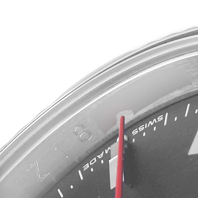 This close-up image shows the bezel, dial, minute markers, and part of the red second hand of the Rolex Turn-o-Graph 116264 Men
s Stainless Steel Black Dial 116264 Men
s Stainless Steel Black Dial watch.