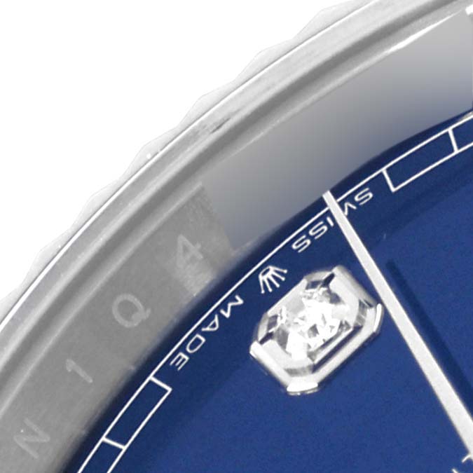 The image shows a close-up of the face and bezel of the Rolex Datejust 41 126334 Men
s Stainless Steel Blue Dial 126334 Men
s Stainless Steel Blue Dial watch, focused on the diamond hour marker and "Swiss Made" text.