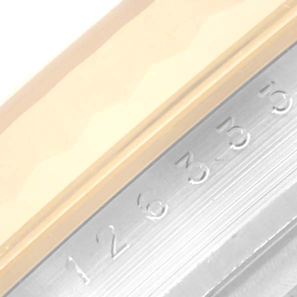 This is a close-up of the watch case and bezel of a Rolex Datejust 41 126333 Men's Steel and Gold (two tone) Champagne Dial 126333 Men's Steel and Gold (two tone) Champagne Dial, showing part of the bezel and the engraved numbers.