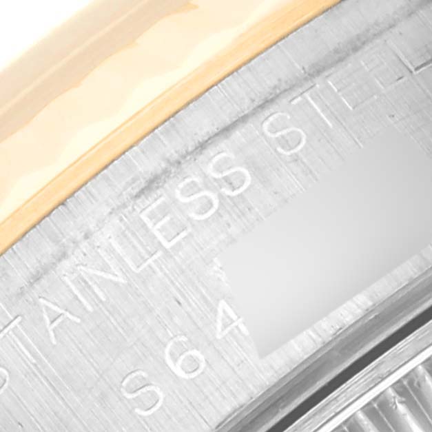 This is a close-up of the Rolex Datejust 69173 Women's Steel and Gold (two tone) Champagne Dial 69173 Women's Steel and Gold (two tone) Champagne Dial's casing, showing the stainless steel inscription.