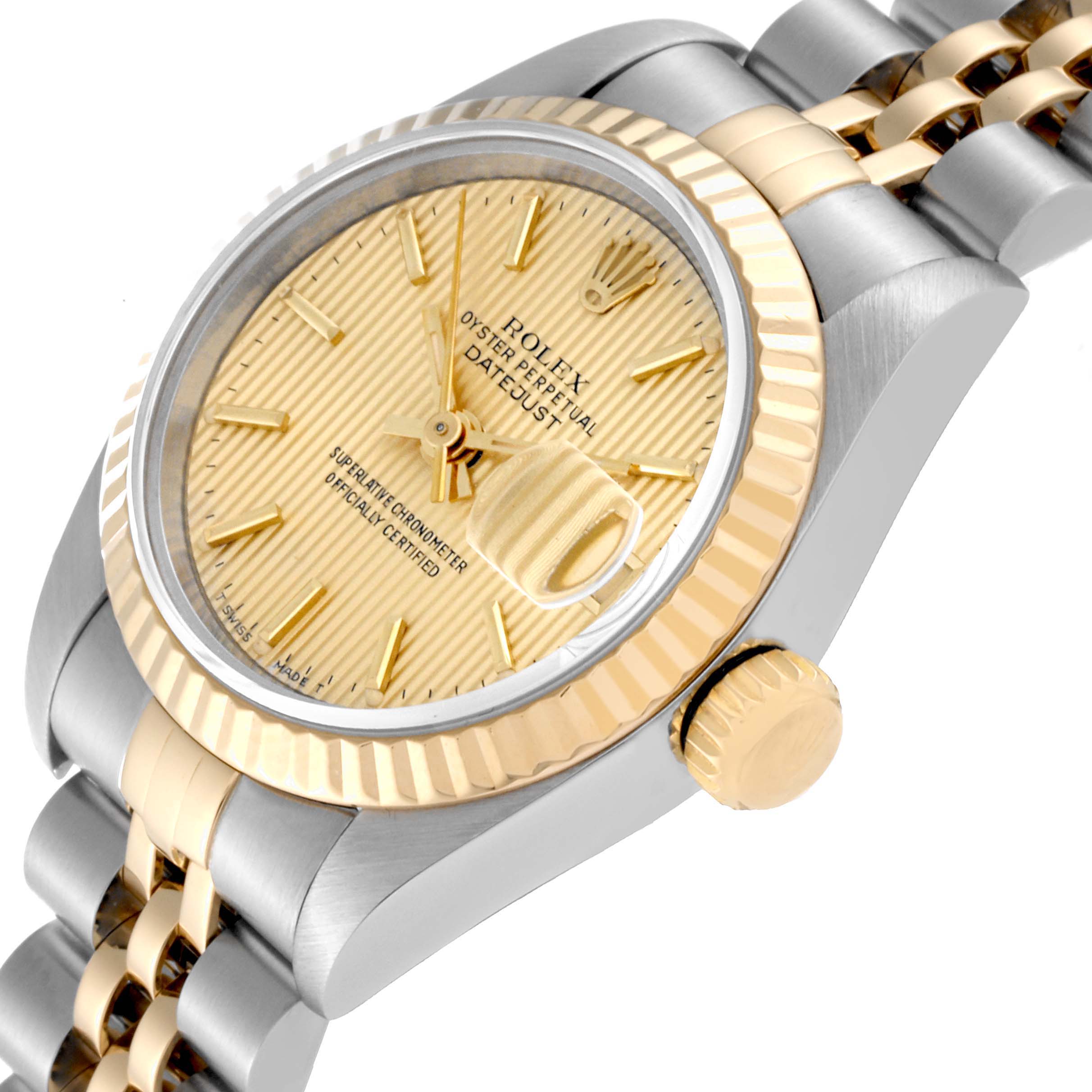 The Rolex Datejust 69173 Women's Steel and Gold (two tone) Champagne Dial 69173 Women's Steel and Gold (two tone) Champagne Dial watch is shown at a tilted angle, highlighting the face, bezel, and part of the band.