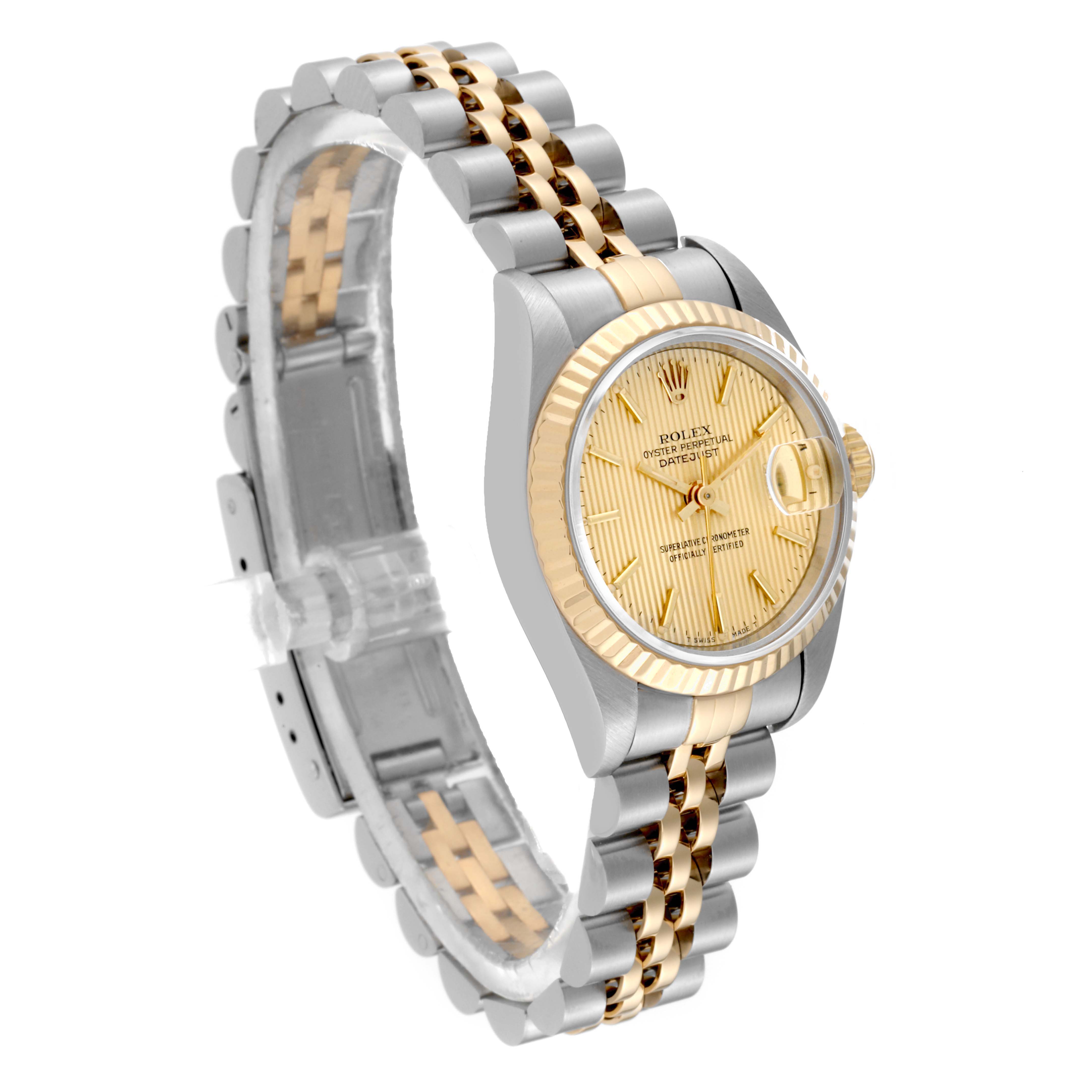 The image shows a Rolex Datejust 69173 Women's Steel and Gold (two tone) Champagne Dial 69173 Women's Steel and Gold (two tone) Champagne Dial watch from a three-quarter angle, highlighting its two-tone band and gold fluted bezel.