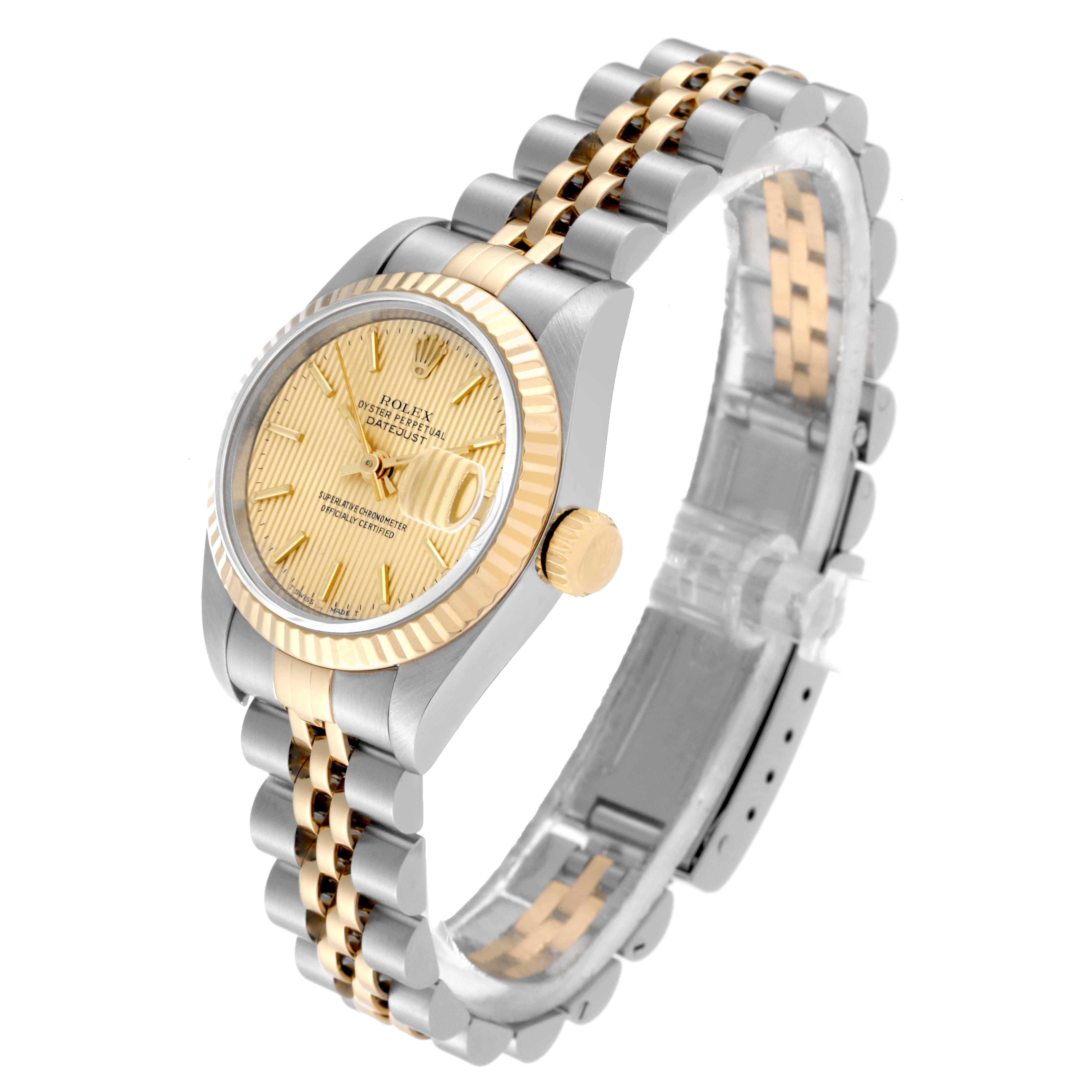 The image shows a Rolex Datejust 69173 Women's Steel and Gold (two tone) Champagne Dial 69173 Women's Steel and Gold (two tone) Champagne Dial watch from an elevated angle, highlighting the face, bezel, crown, and two-tone bracelet.