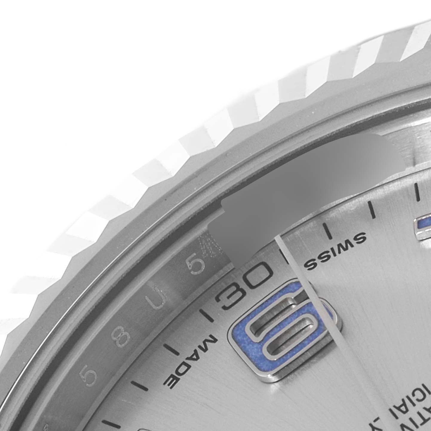 This partial view of the Rolex Datejust 41 116334 Men's Stainless Steel Silver Dial 116334 Men's Stainless Steel Silver Dial model shows a close-up of the fluted bezel and part of the watch dial with the number "30".
