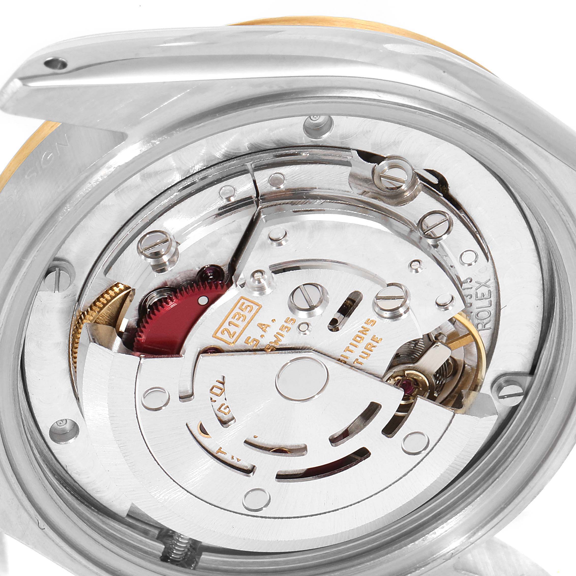 The image shows the movement mechanism of a mid-size Rolex watch from a top-down angle.