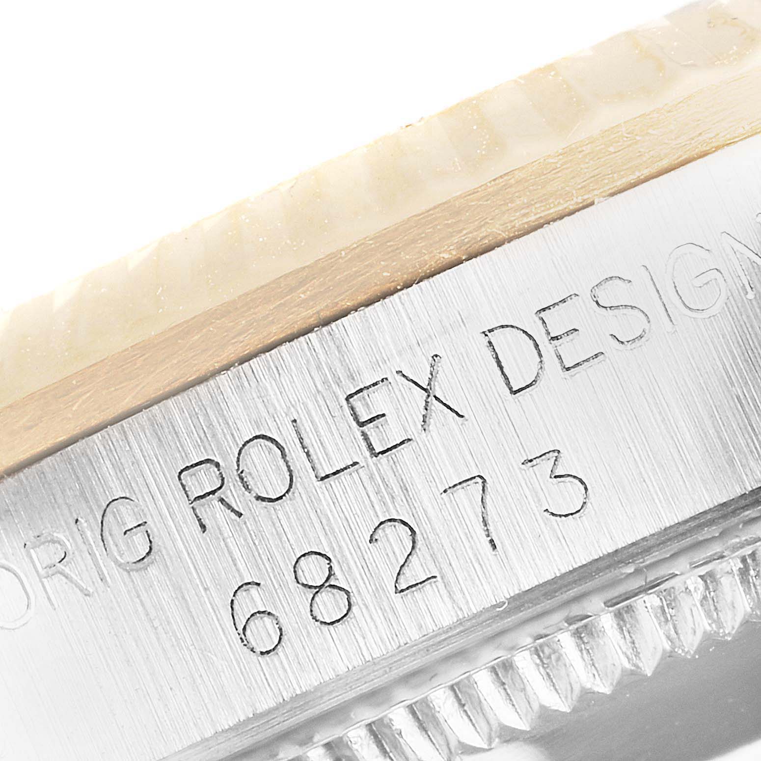 The image shows a close-up of the side engraving on the bezel and case of a Mid-Size Rolex watch, displaying the model number 68273.