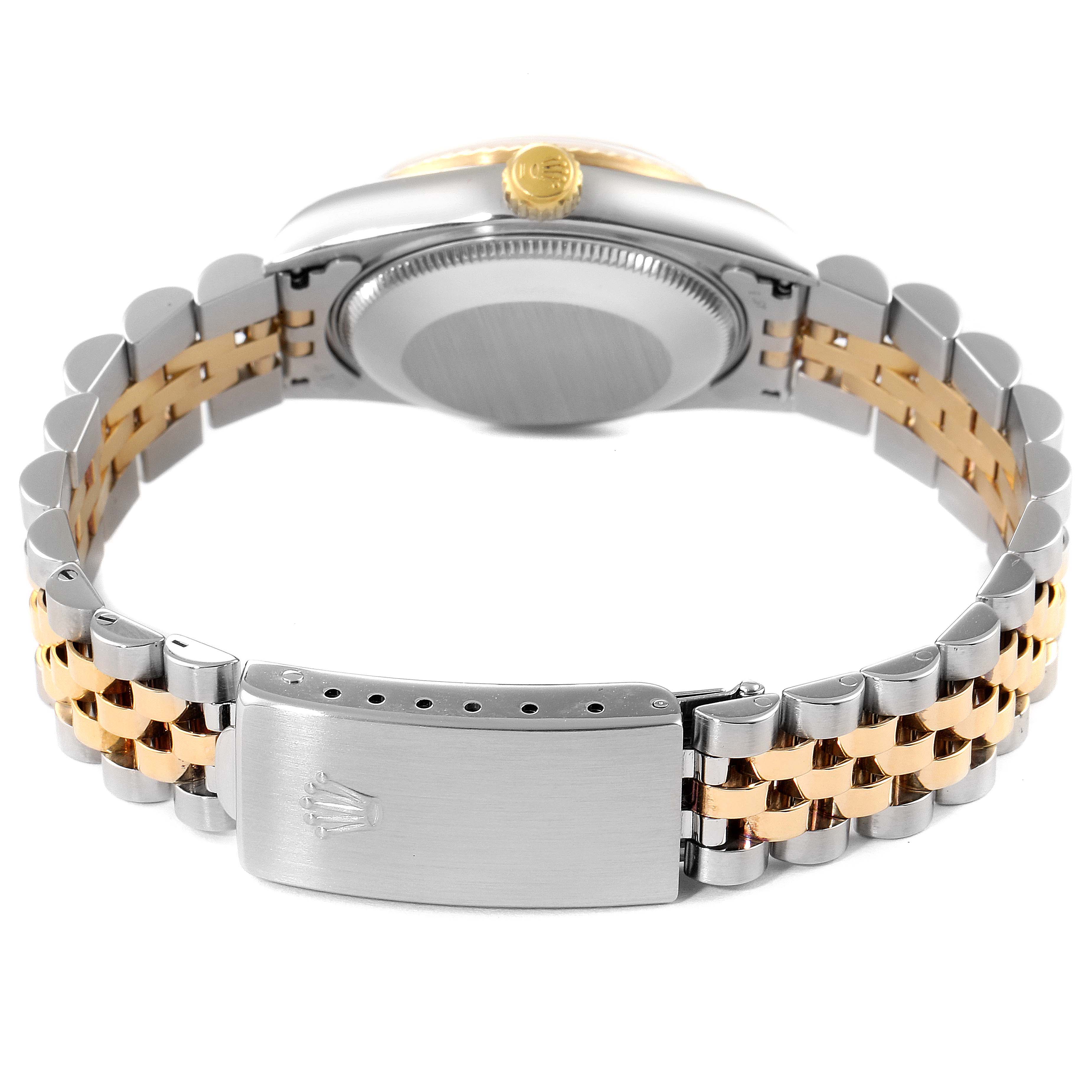 The image shows the back and side profile of a mid-size Rolex watch, highlighting its bracelet and clasp.