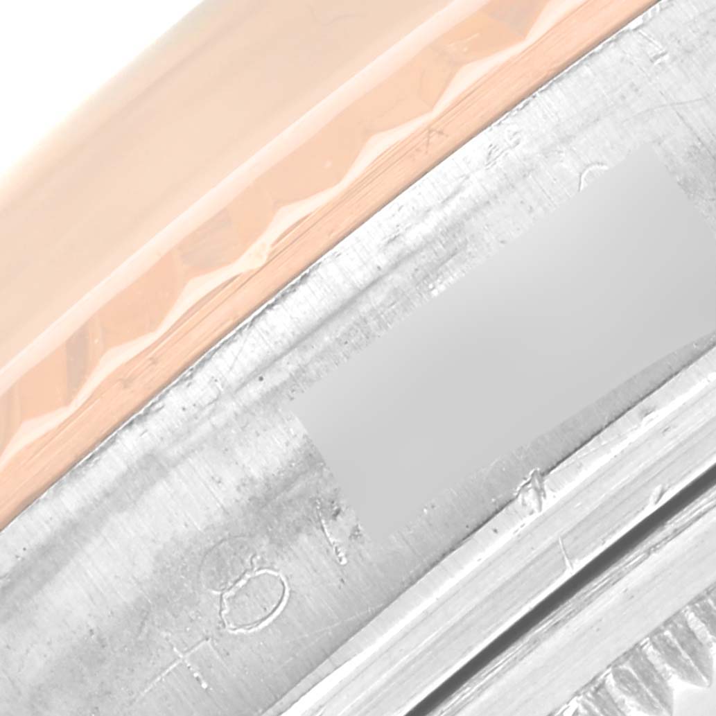 This image shows a close-up of the bezel and part of the case of a Vintage Collection model by Rolex.