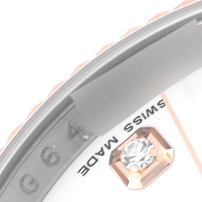 This image of the Rolex Datejust 116231 Men's Steel and Gold (two tone) White Dial 116231 Men's Steel and Gold (two tone) White Dial watch shows a close-up of the bezel, diamond hour marker, and part of the dial.