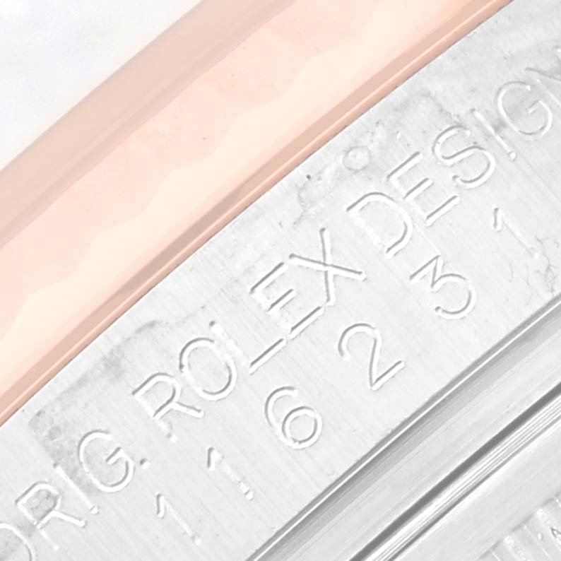 This close-up image shows the engraved details on the case side of a Rolex Datejust 116231 Men's Steel and Gold (two tone) White Dial 116231 Men's Steel and Gold (two tone) White Dial watch.