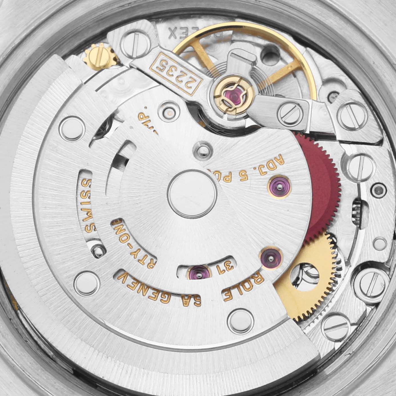 The image shows a close-up view of the Rolex Datejust 79174 Women's Stainless Steel White Dial 79174 Women's Stainless Steel White Dial watch movement, highlighting its intricate mechanical parts and engravings.