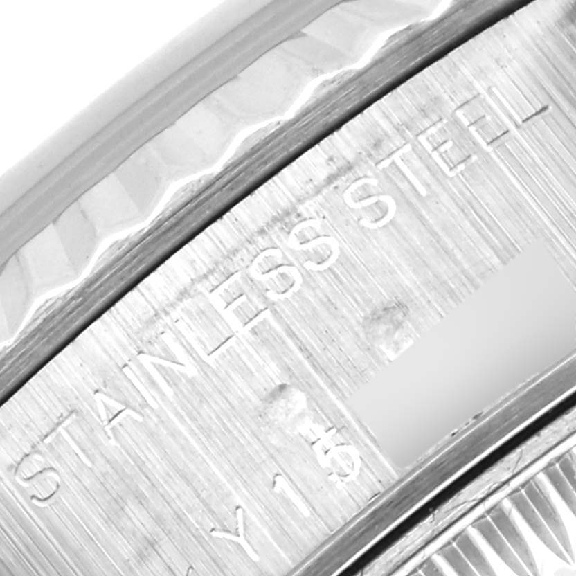 Close-up view of the engraved text on the stainless steel bezel of a Rolex Datejust 79174 Women's Stainless Steel White Dial 79174 Women's Stainless Steel White Dial watch.