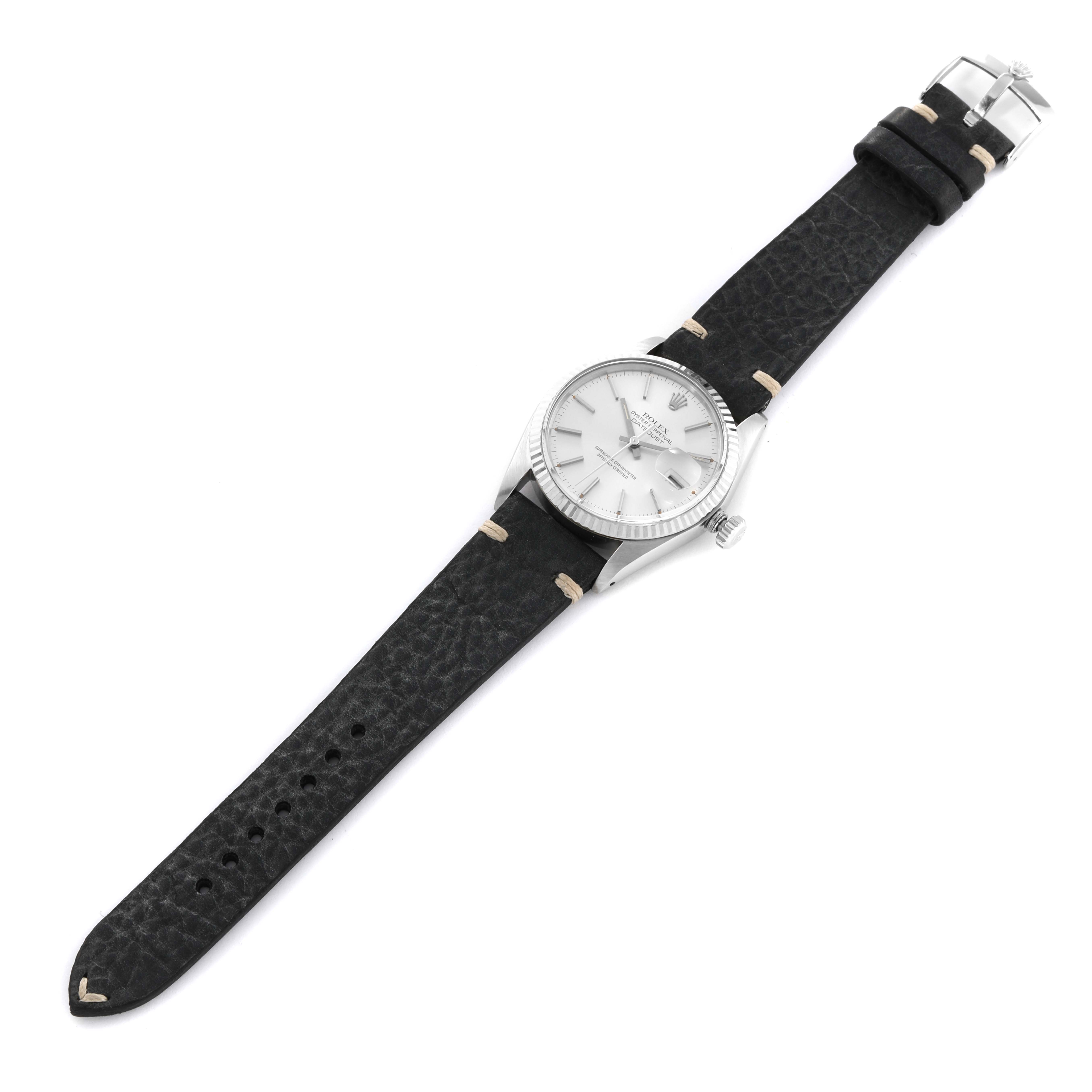 The Rolex Vintage Collection 16014 Men's Stainless Steel Silver Dial 16014 Men's Stainless Steel Silver Dial model is shown from a top-down angle, highlighting the watch face, bezel, crown, and black leather strap.