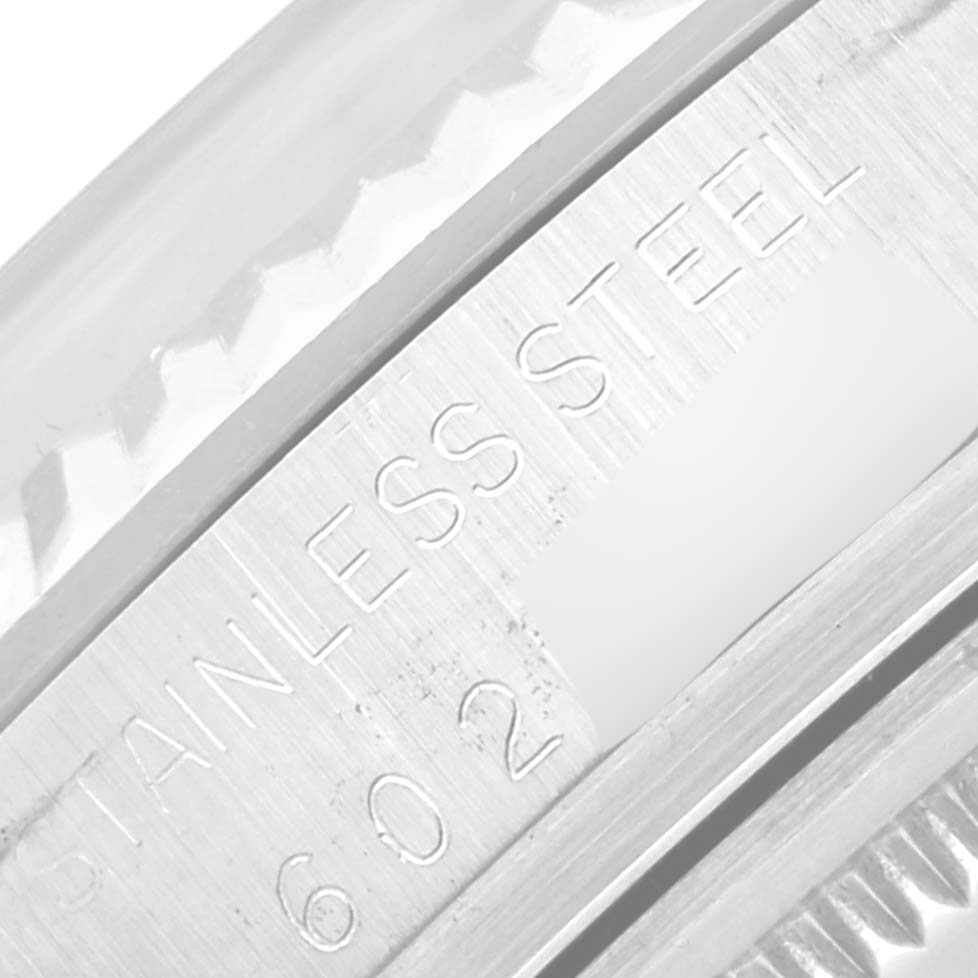 The image shows a close-up of the engraving on a stainless steel part of the Rolex Vintage Collection 16014 Men's Stainless Steel Silver Dial 16014 Men's Stainless Steel Silver Dial watch.