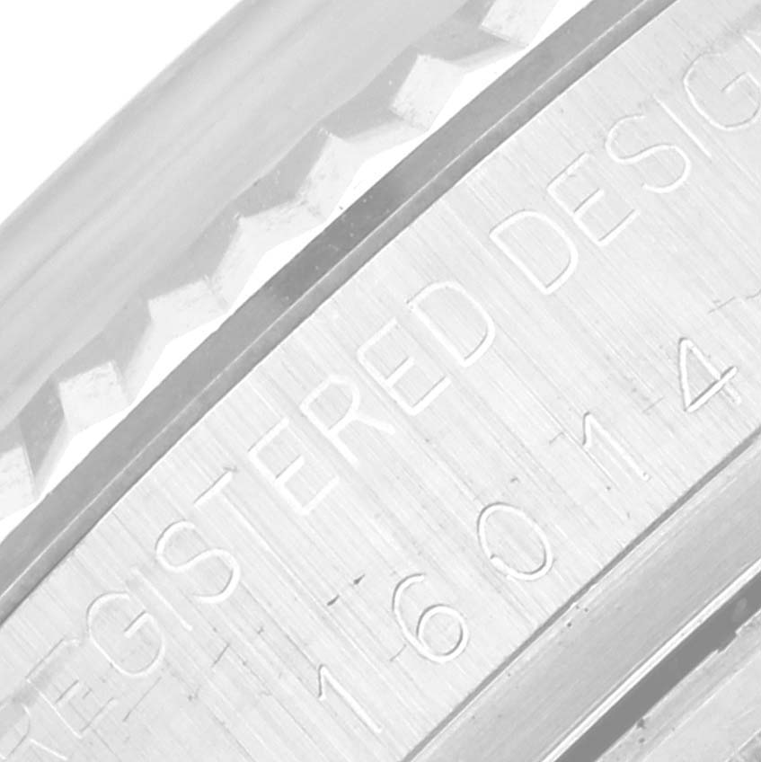 This close-up image of the Rolex Vintage Collection 16014 Men's Stainless Steel Silver Dial 16014 Men's Stainless Steel Silver Dial watch shows part of its engraved case with the model number "16014."