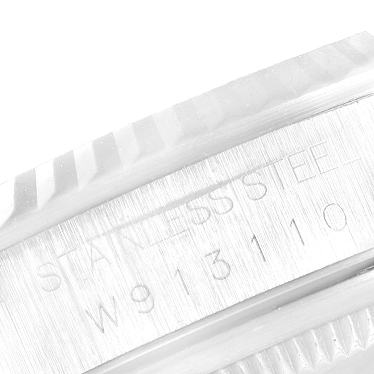 This image shows a close-up of the stainless steel with engravings on the case side of a Rolex Datejust 16234 Men's Stainless Steel Silver Dial 16234 Men's Stainless Steel Silver Dial watch.