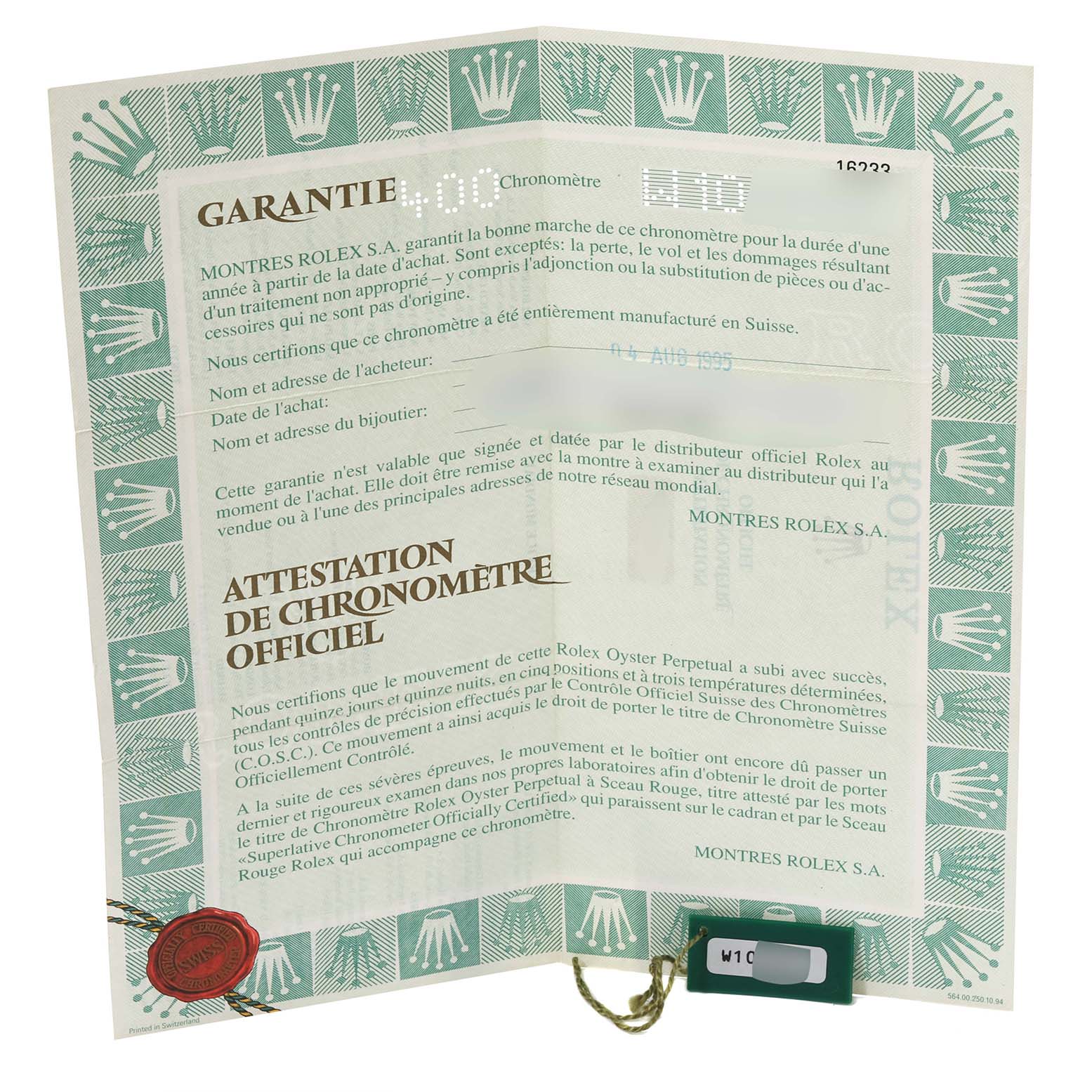 This image shows the guarantee and chronometer certificate for a Rolex Datejust 16233 Men's Steel and Gold (two tone) Black Dial 16233 Men's Steel and Gold (two tone) Black Dial model, positioned flat and open.