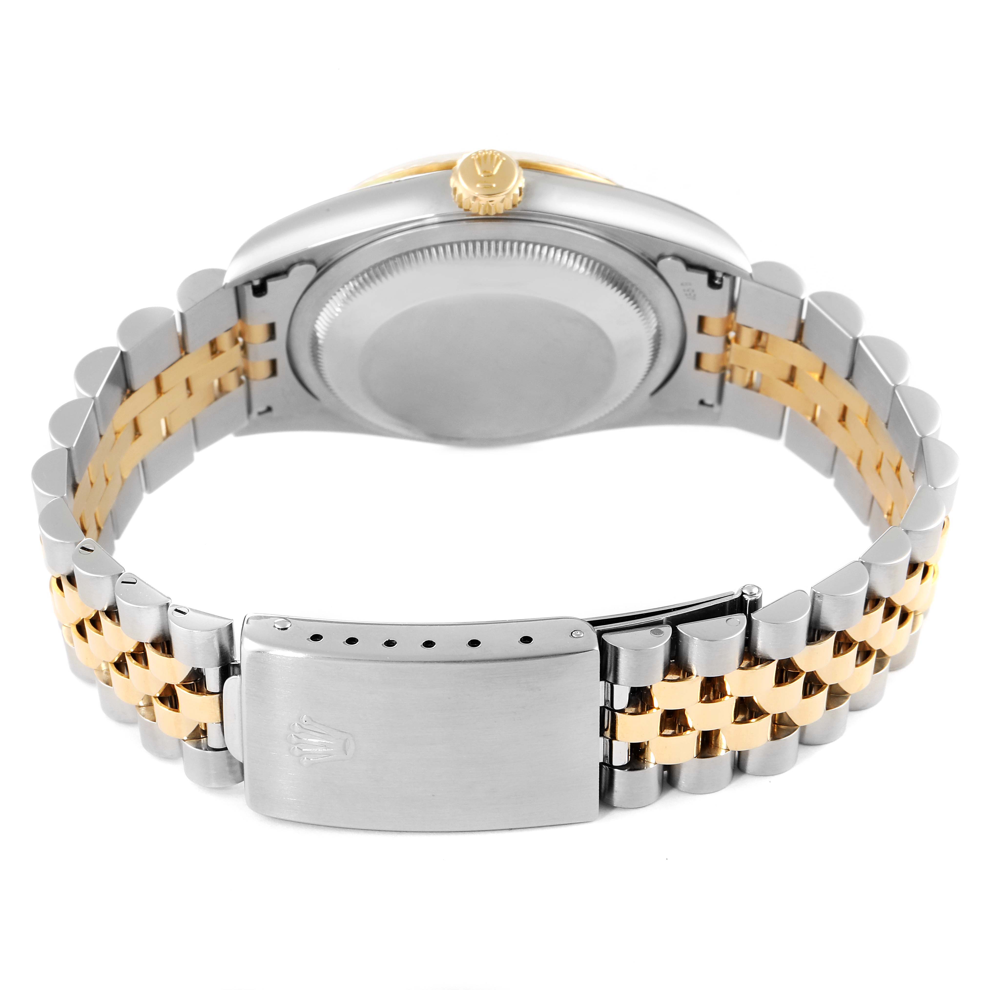 The image shows the back case and the bracelet clasp of a Rolex Datejust 16233 Men's Steel and Gold (two tone) Champagne Dial 16233 Men's Steel and Gold (two tone) Champagne Dial watch, highlighting its two-tone metal design.