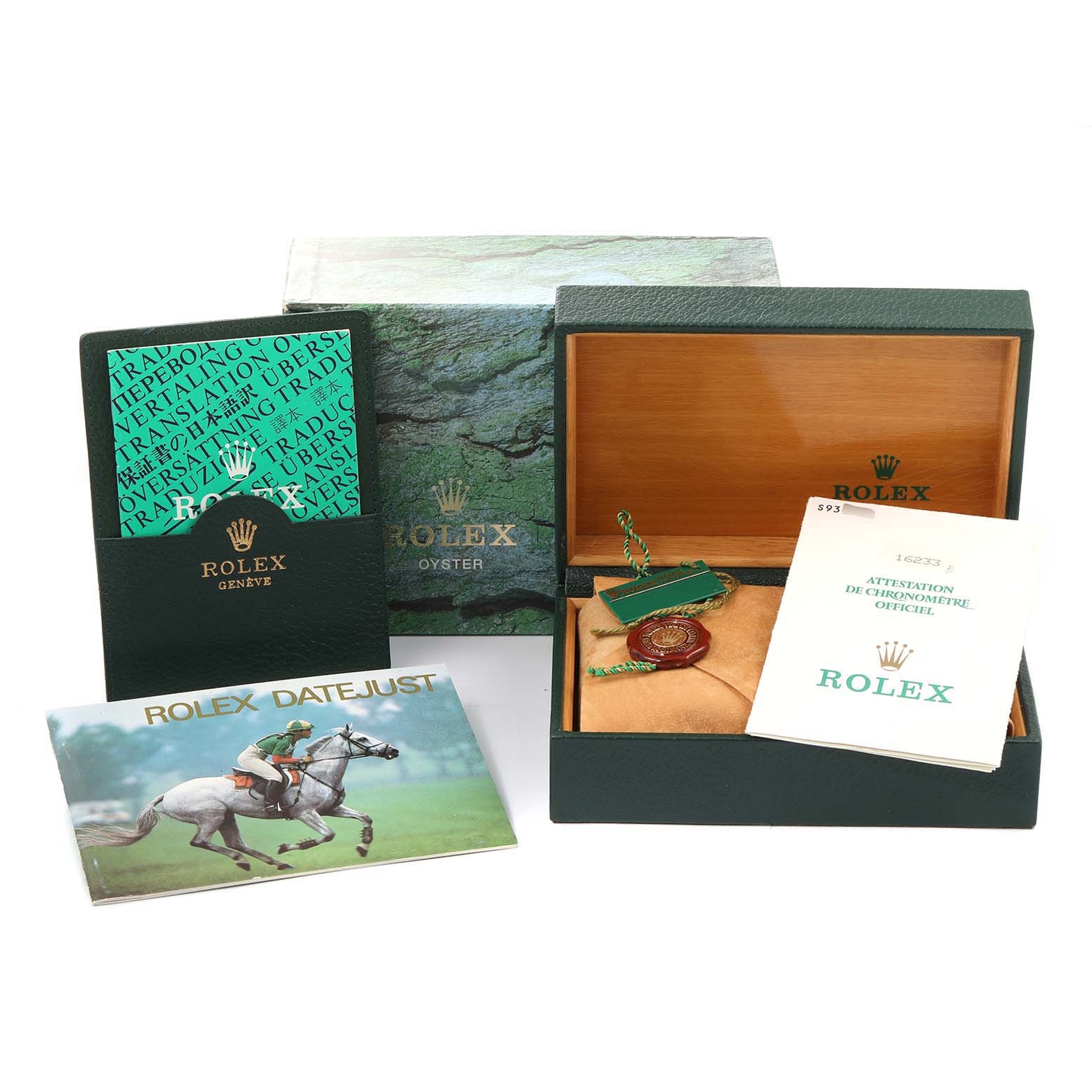 This image shows the packaging, including box, tags, and booklets, for a Rolex Datejust 16233 Men's Steel and Gold (two tone) Champagne Dial 16233 Men's Steel and Gold (two tone) Champagne Dial model watch.