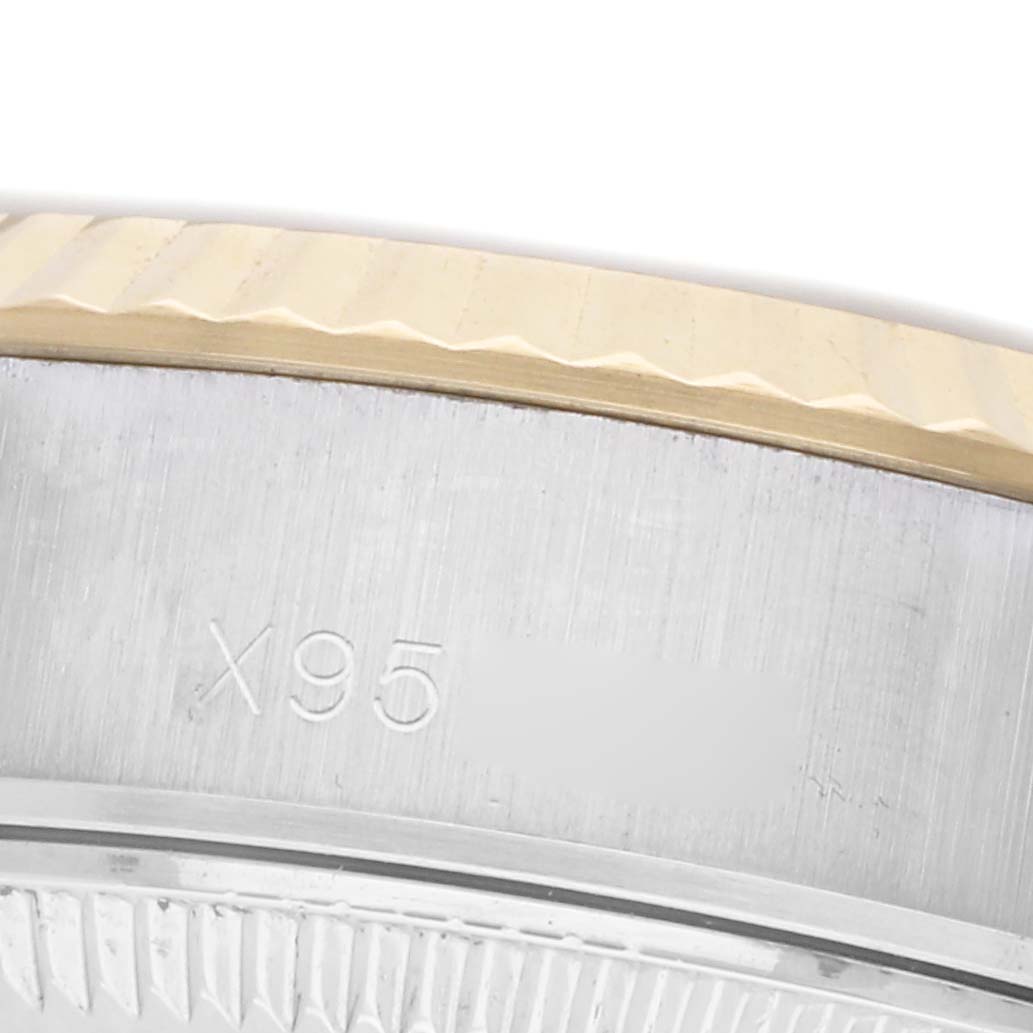 This close-up image shows the bezel and case side of a Rolex Datejust 69173 Women's Steel and Gold (two tone) Champagne Dial 69173 Women's Steel and Gold (two tone) Champagne Dial, highlighting the fluted bezel and part of the serial engraving.
