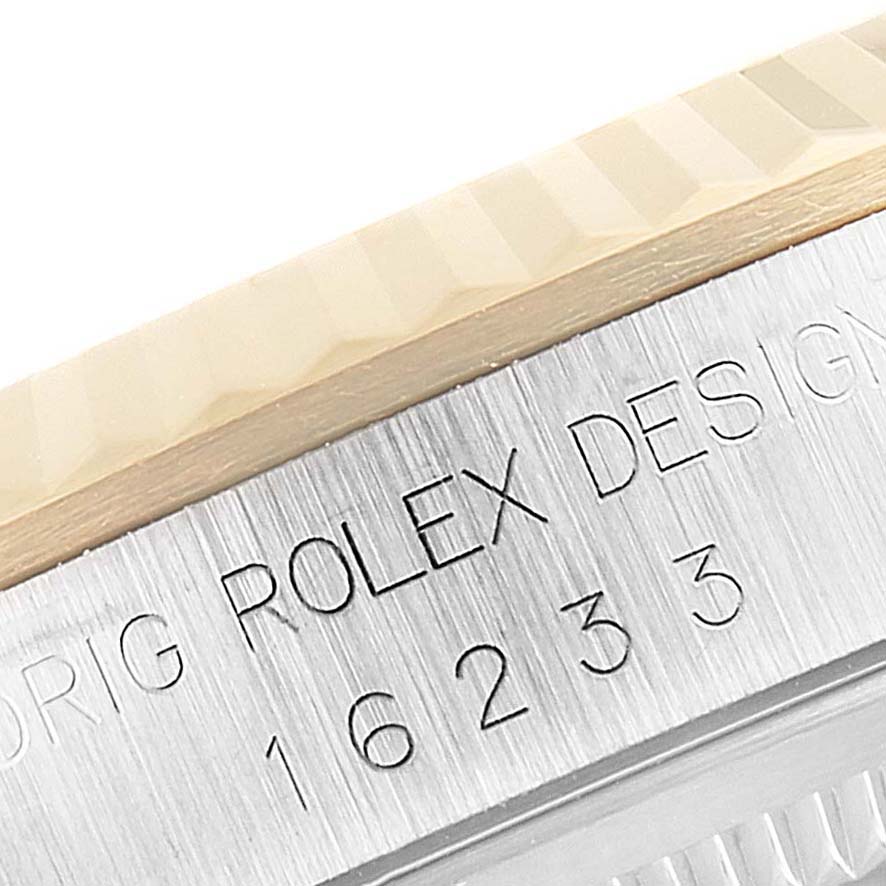 The image shows a close-up of the side of a Rolex Datejust 16233 Men's Steel and Gold (two tone) Beige Dial 16233 Men's Steel and Gold (two tone) Beige Dial watch, highlighting the model number and fluted bezel.