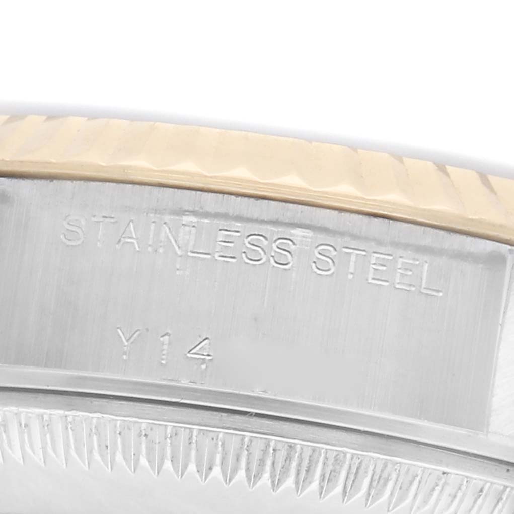 The image shows a close-up of the case side of a Rolex Datejust 79173 Women's Steel and Gold (two tone) White Dial 79173 Women's Steel and Gold (two tone) White Dial model, highlighting the stainless steel engraving.
