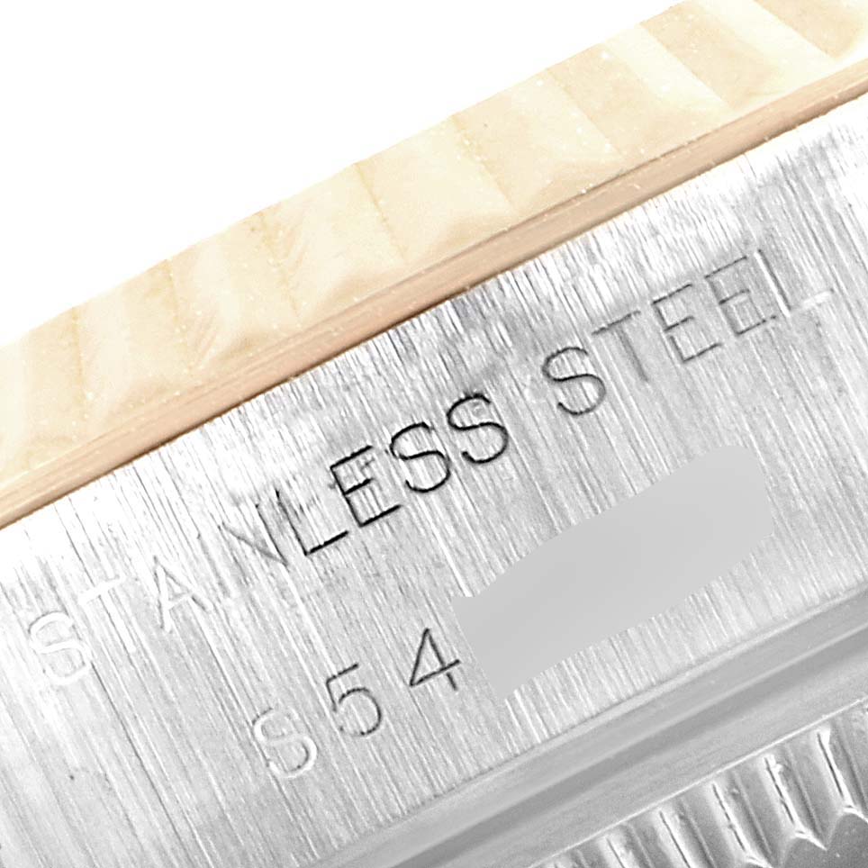 Close-up of the engraving on the stainless steel bezel of a Rolex Datejust 69173 Women
s Steel and Gold (two tone) Silver Dial 69173 Women
s Steel and Gold (two tone) Silver Dial watch.